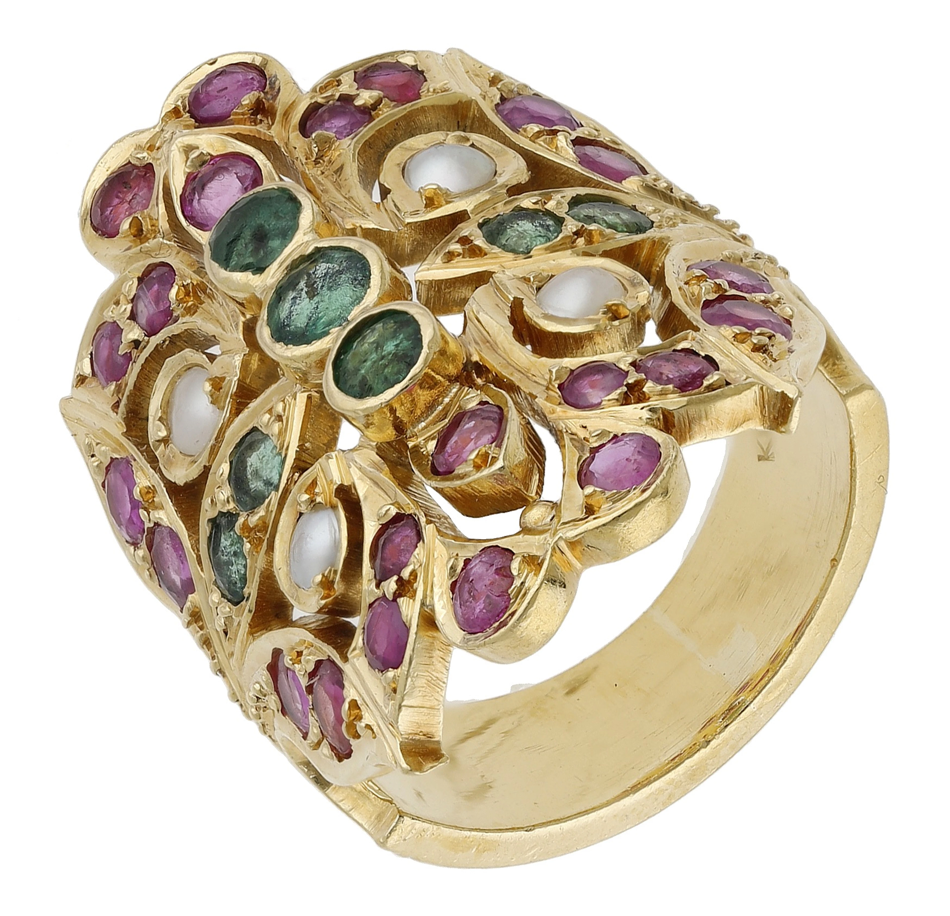 An Indian gem-set dress ring, the pierced foliate plaque set throughout