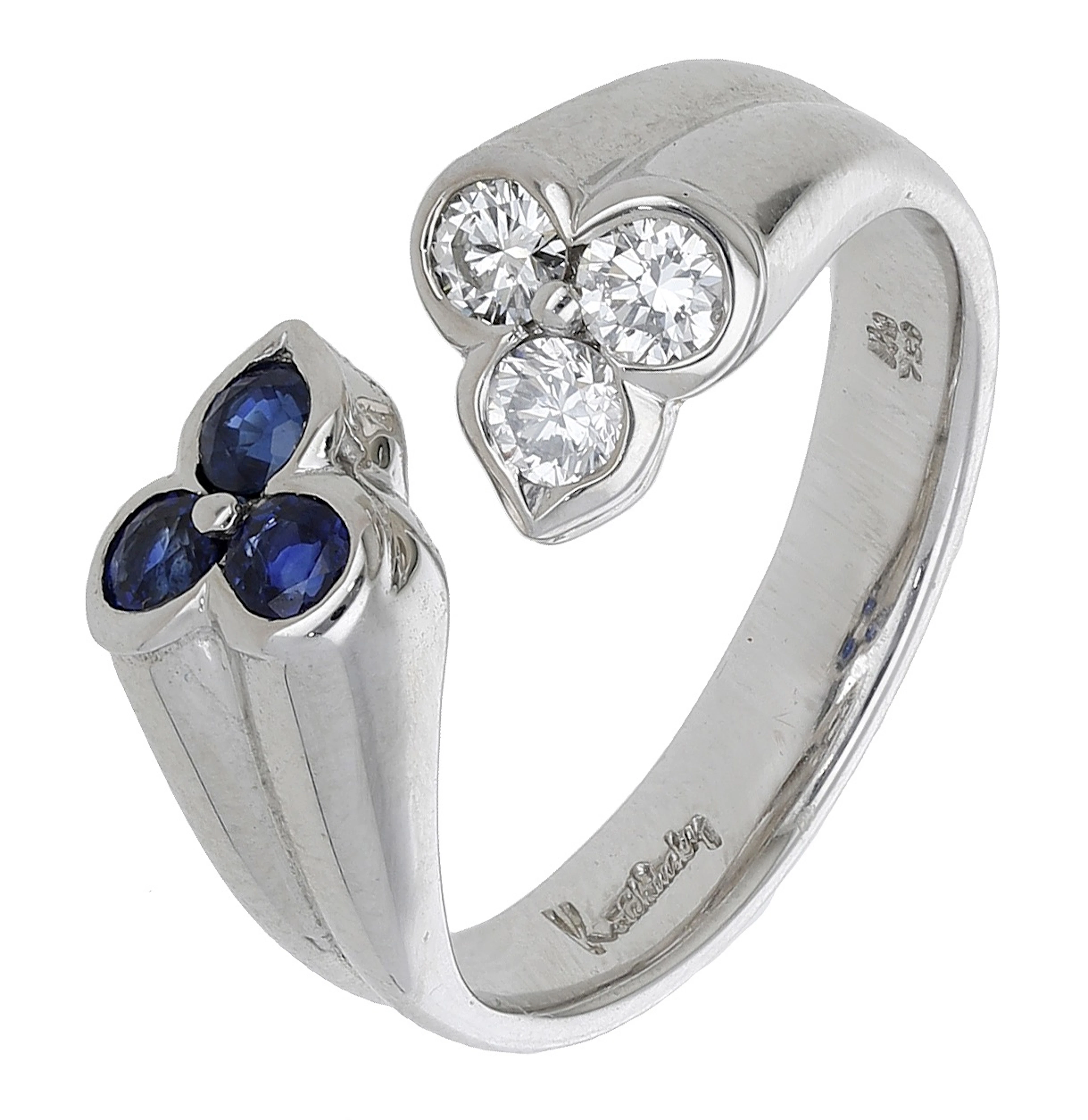 A diamond and sapphire ring by Kutchinsky, of ribbed torque design