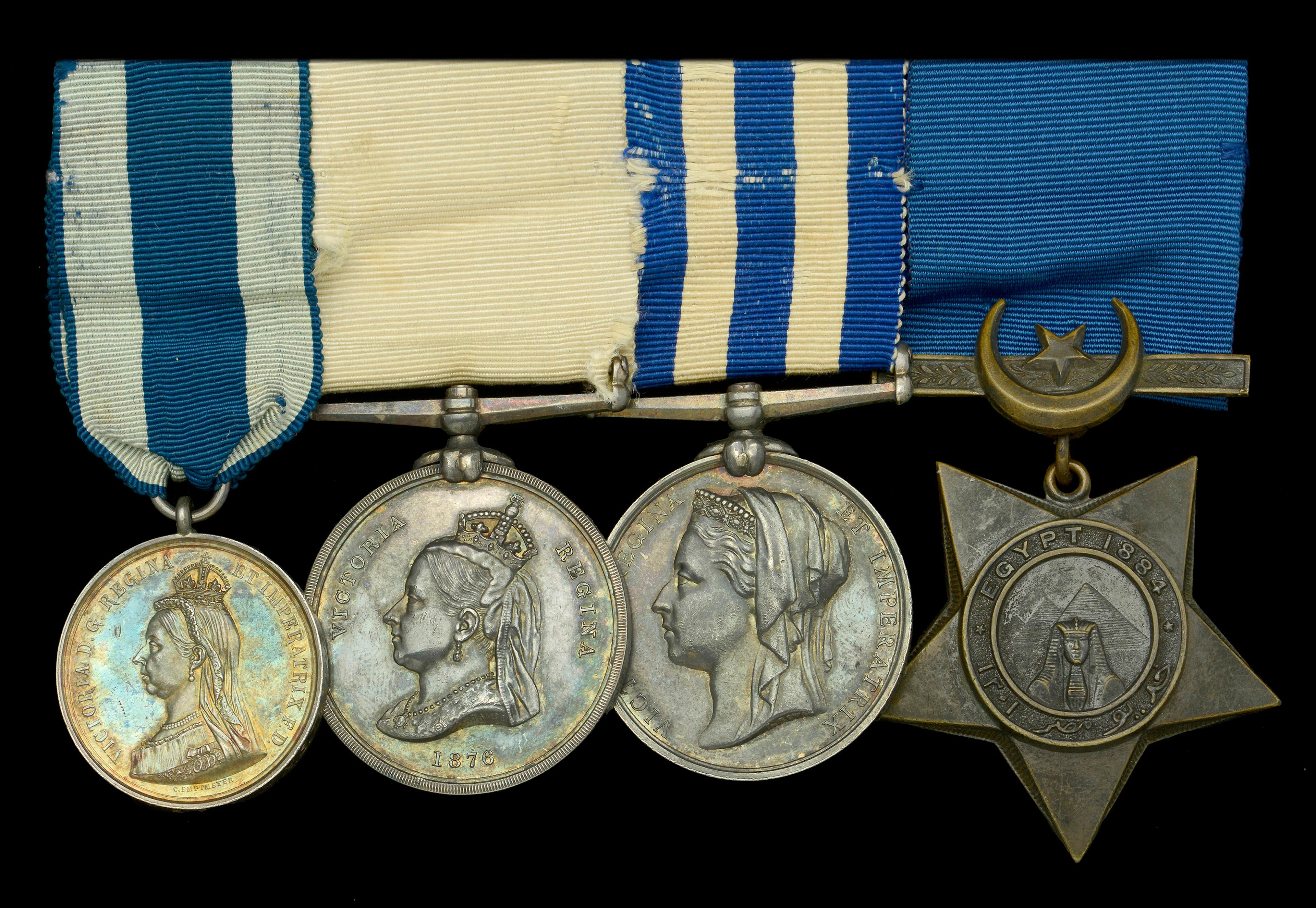 A scarce Arctic exploration group of four awarded to Captain George