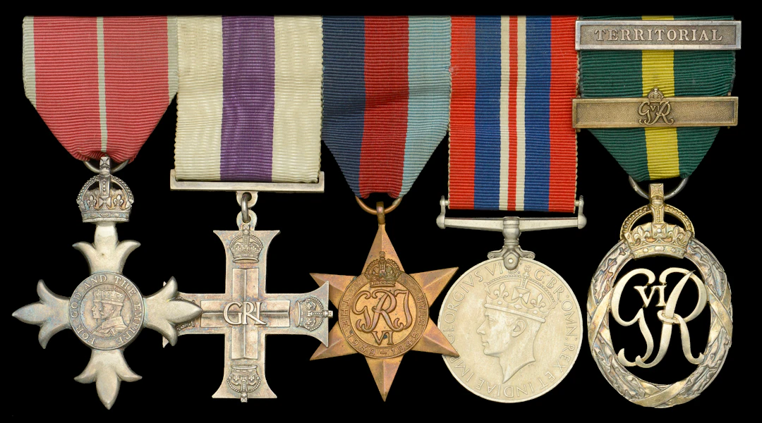 A rare Second War ‘Prisoner of War’ M.B.E., ‘Defence of Calais’ M.C.