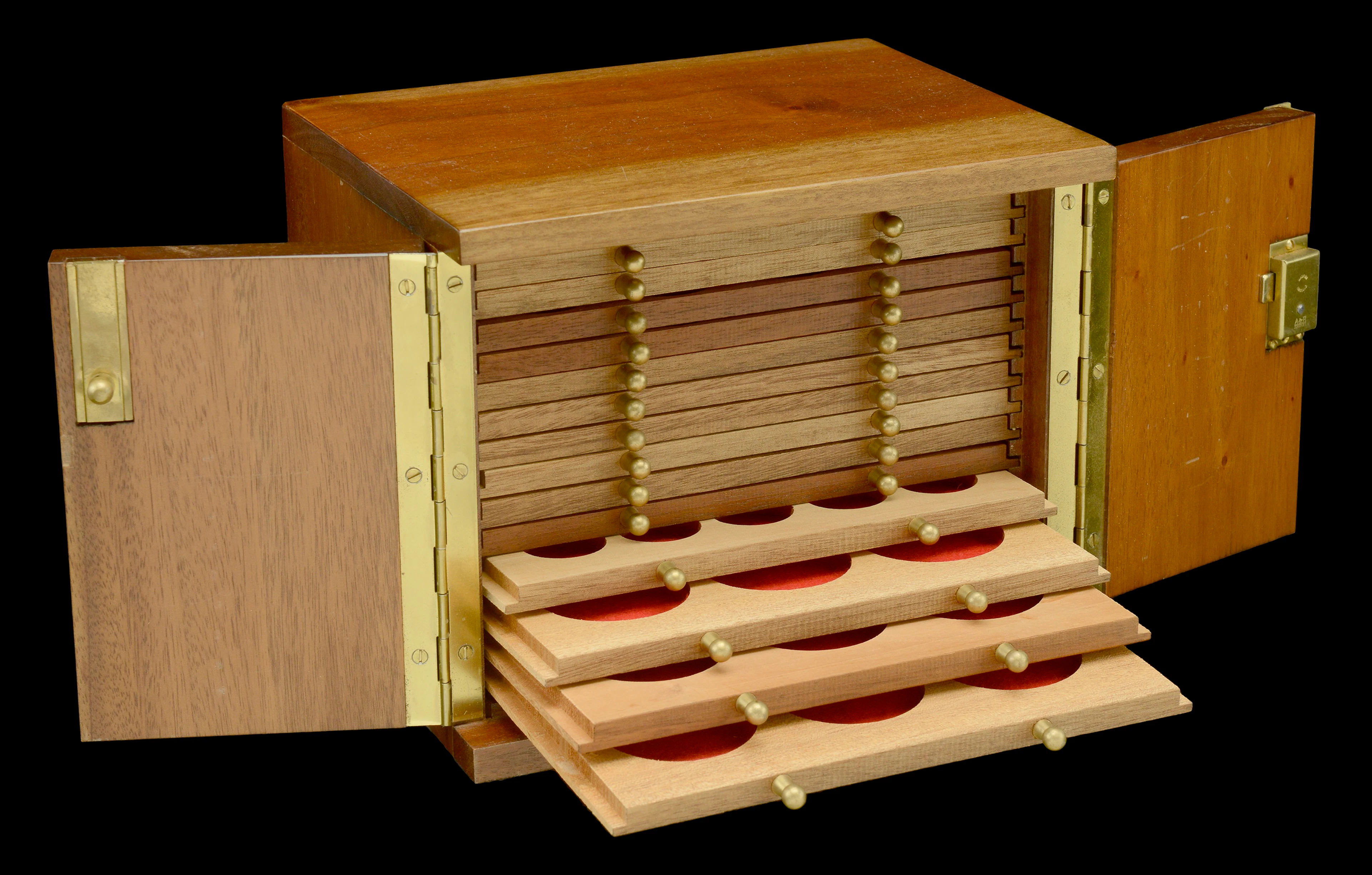 A wooden coin cabinet by Peter Nichols, 22 x 17.5 x 17.5 cm, comprising