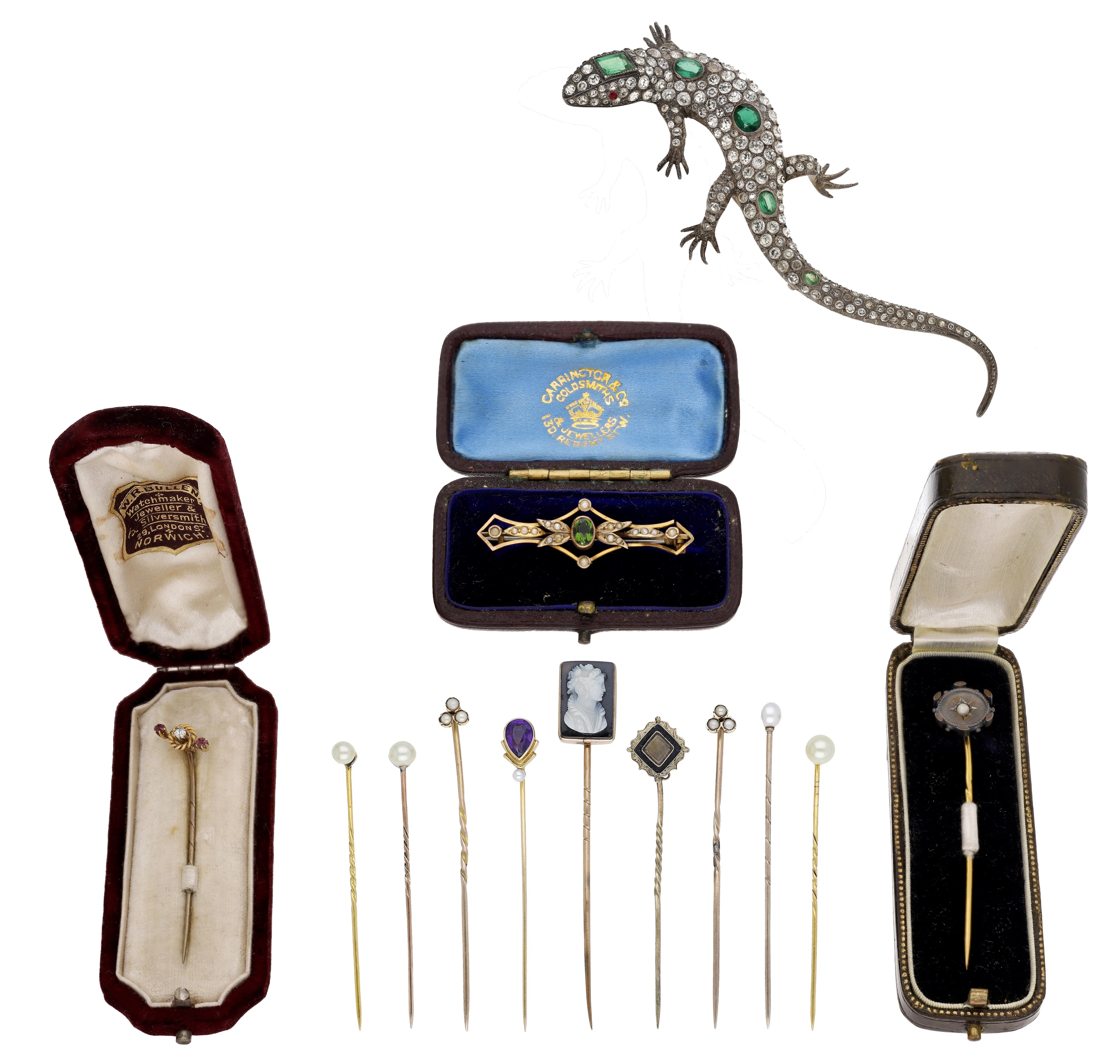 A collection of antique stickpins and brooches, to include a hardstone