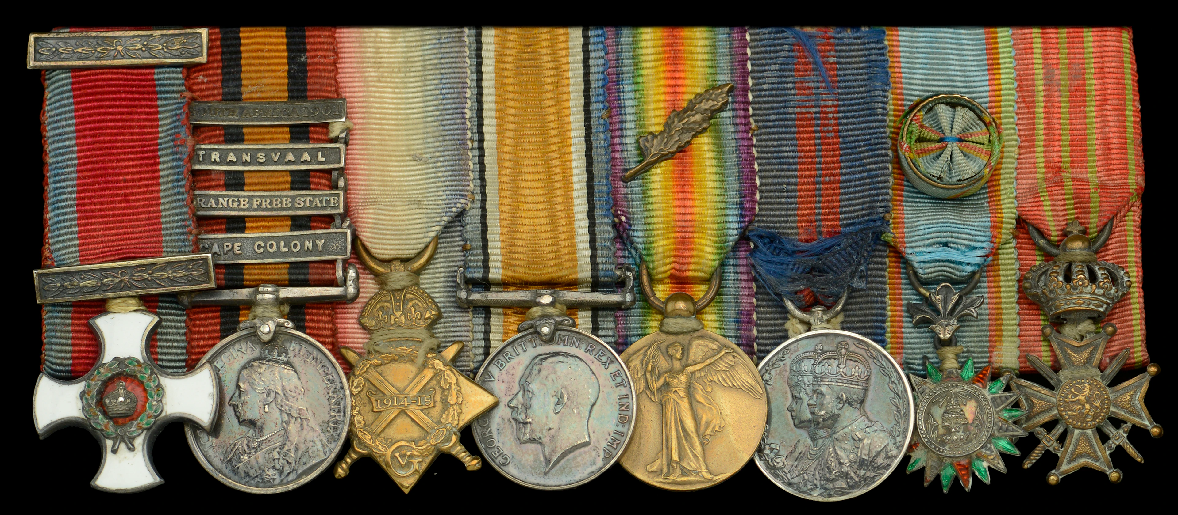 A Great War D.S.O. mounted group of eight miniature dress medals attributed