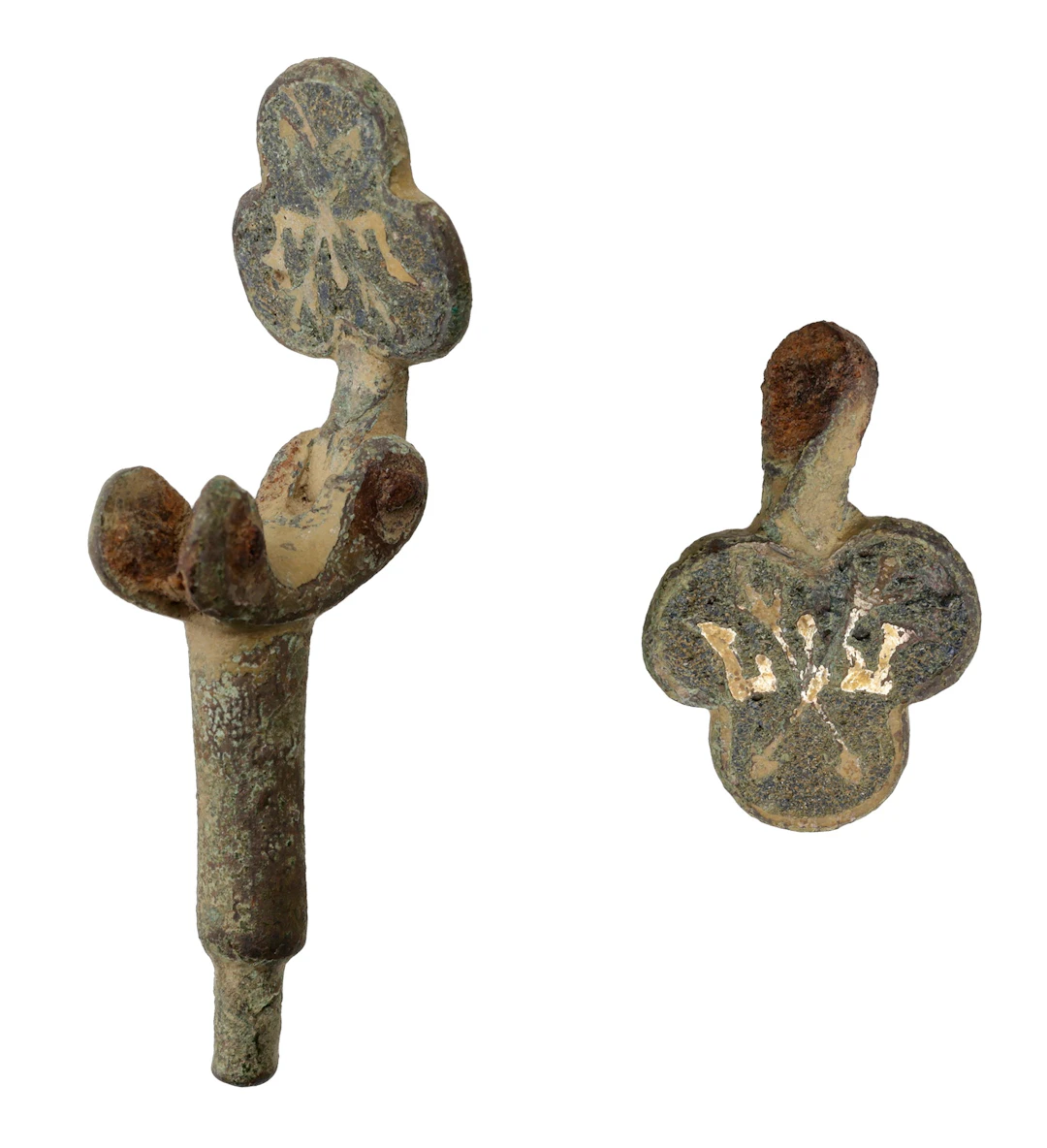 Medieval, 14th century, a pair of trefoil shape heraldic horse pendants