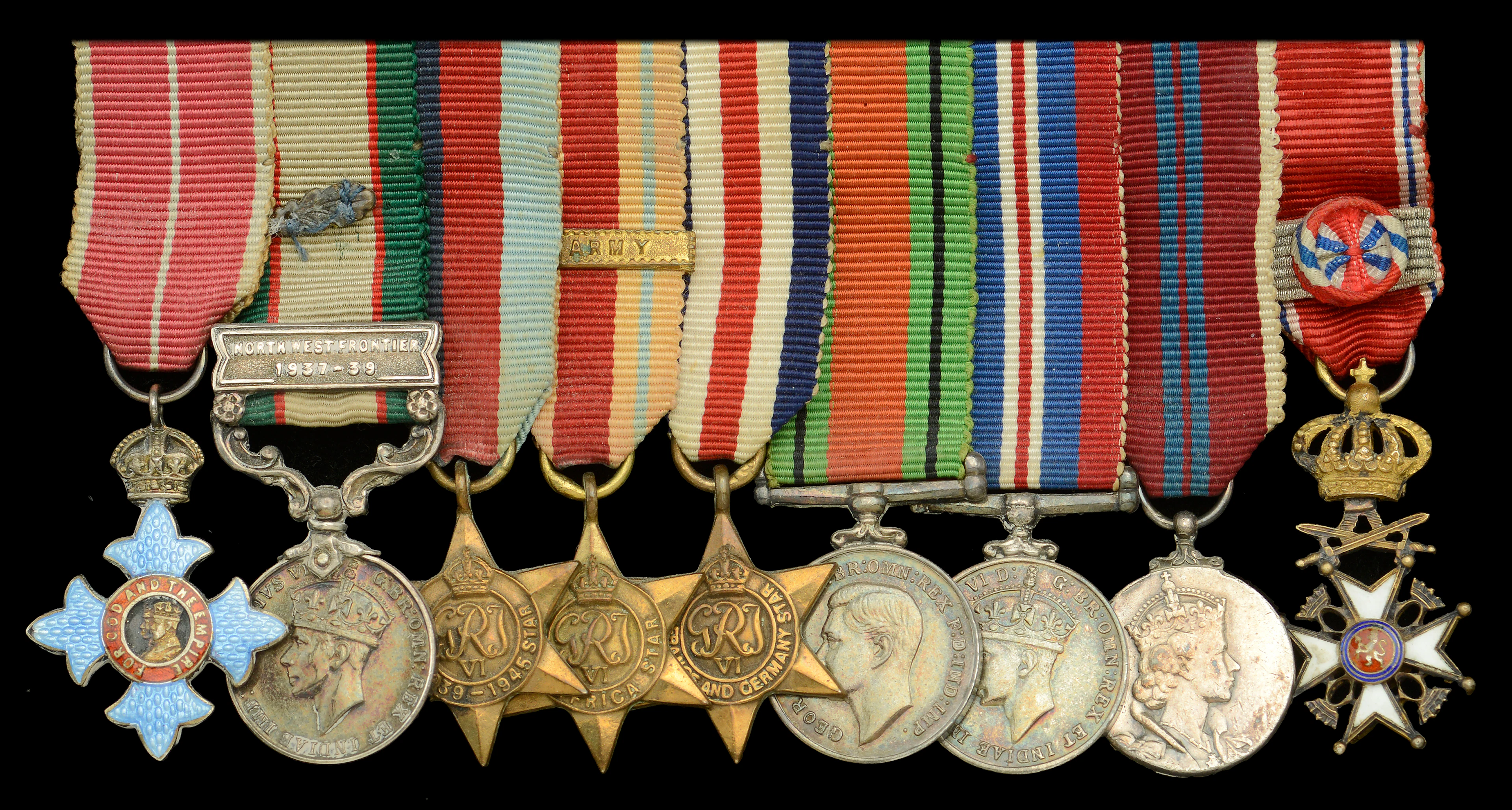 A post-War C.B.E. mounted group of nine miniature dress medals attributed