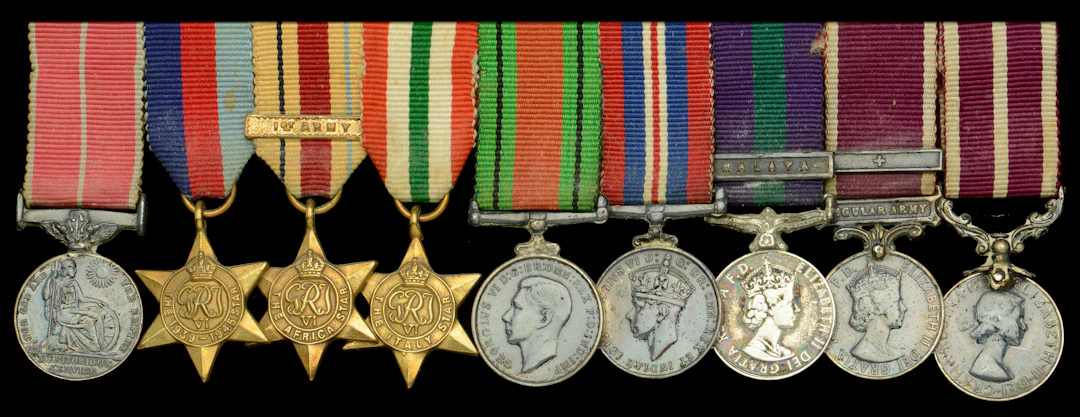 A post-War B.E.M. mounted group of nine miniature dress medals attributed