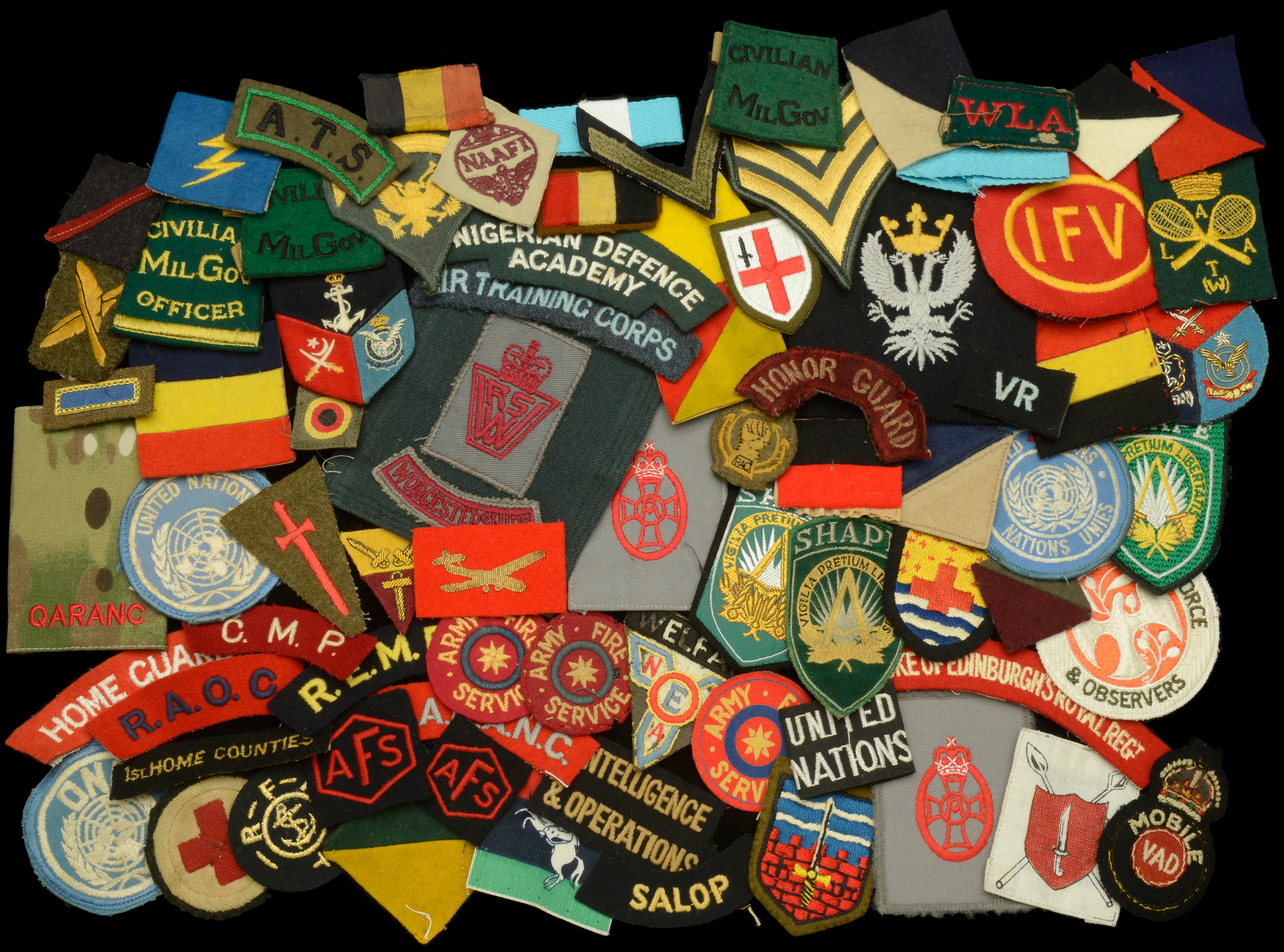 Assorted British and Overseas cloth Insignia. A very good, extensive