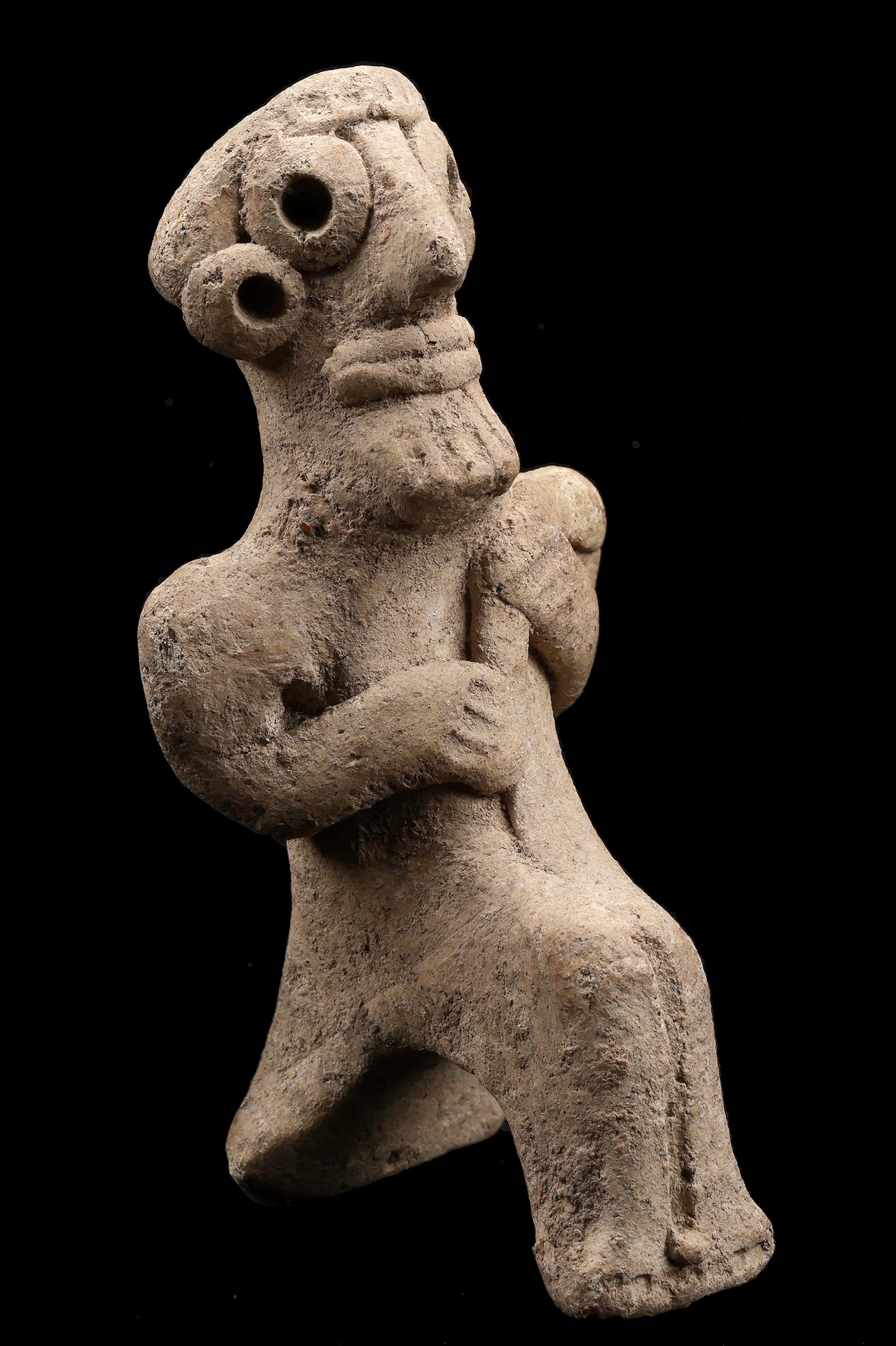 Syro-Hittite, 2nd millennium BC, votive buff-coloured terracotta statuette