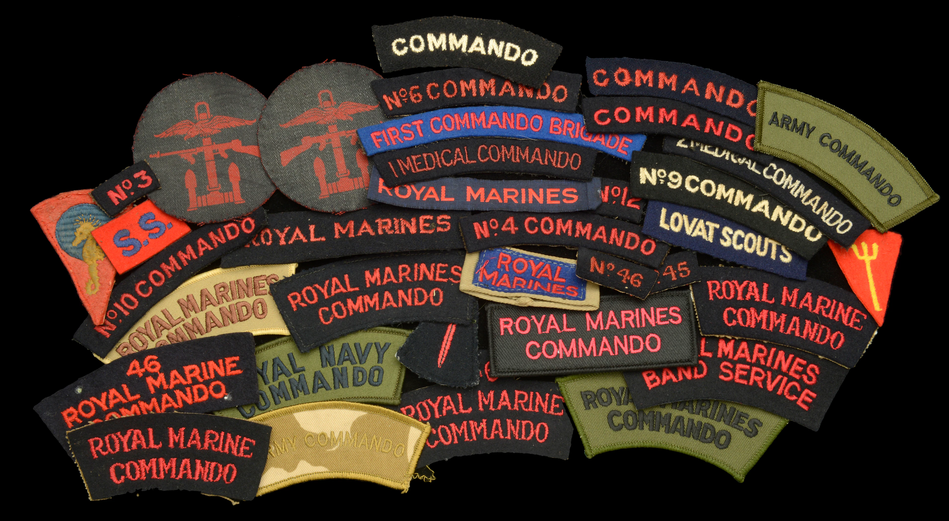 Assorted British Commando cloth Insignia. A very good selection of