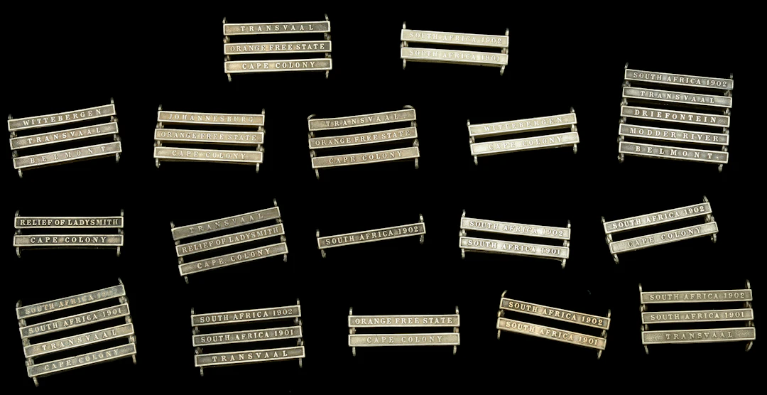 Clasps: A selection of clasps for the Queen’s South Africa Medal