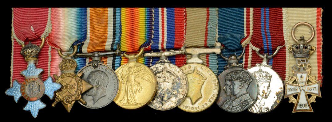 A post-War C.B.E. mounted group of nine miniature dress medals attributed
