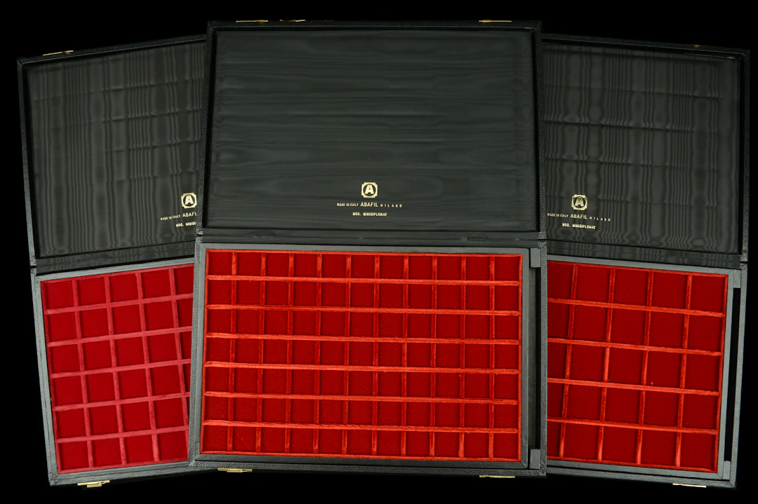 A trio of Abafil Minidiplomat cases (3), each with two loose trays