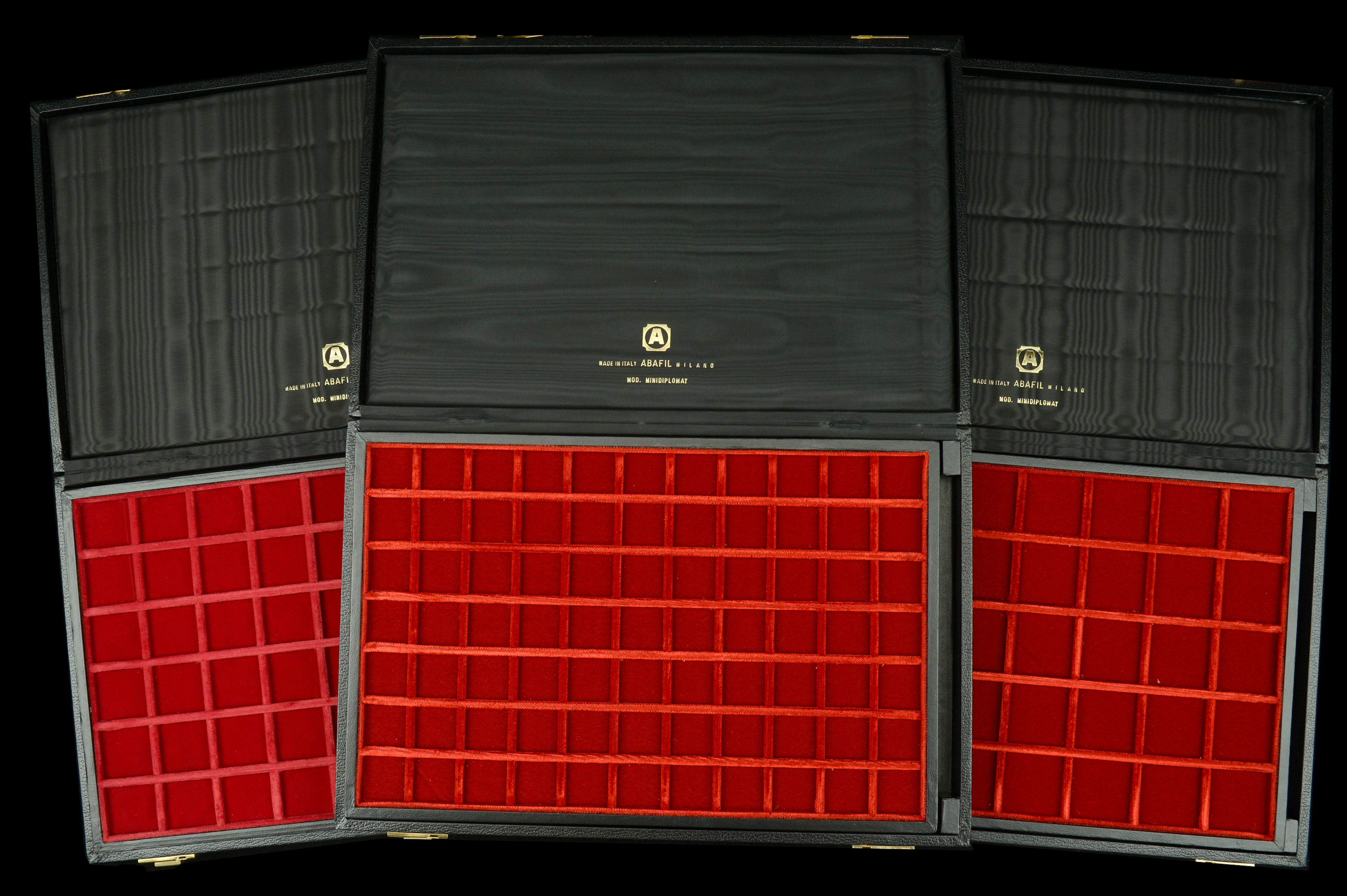 A trio of Abafil Minidiplomat cases (3), each with two loose trays
