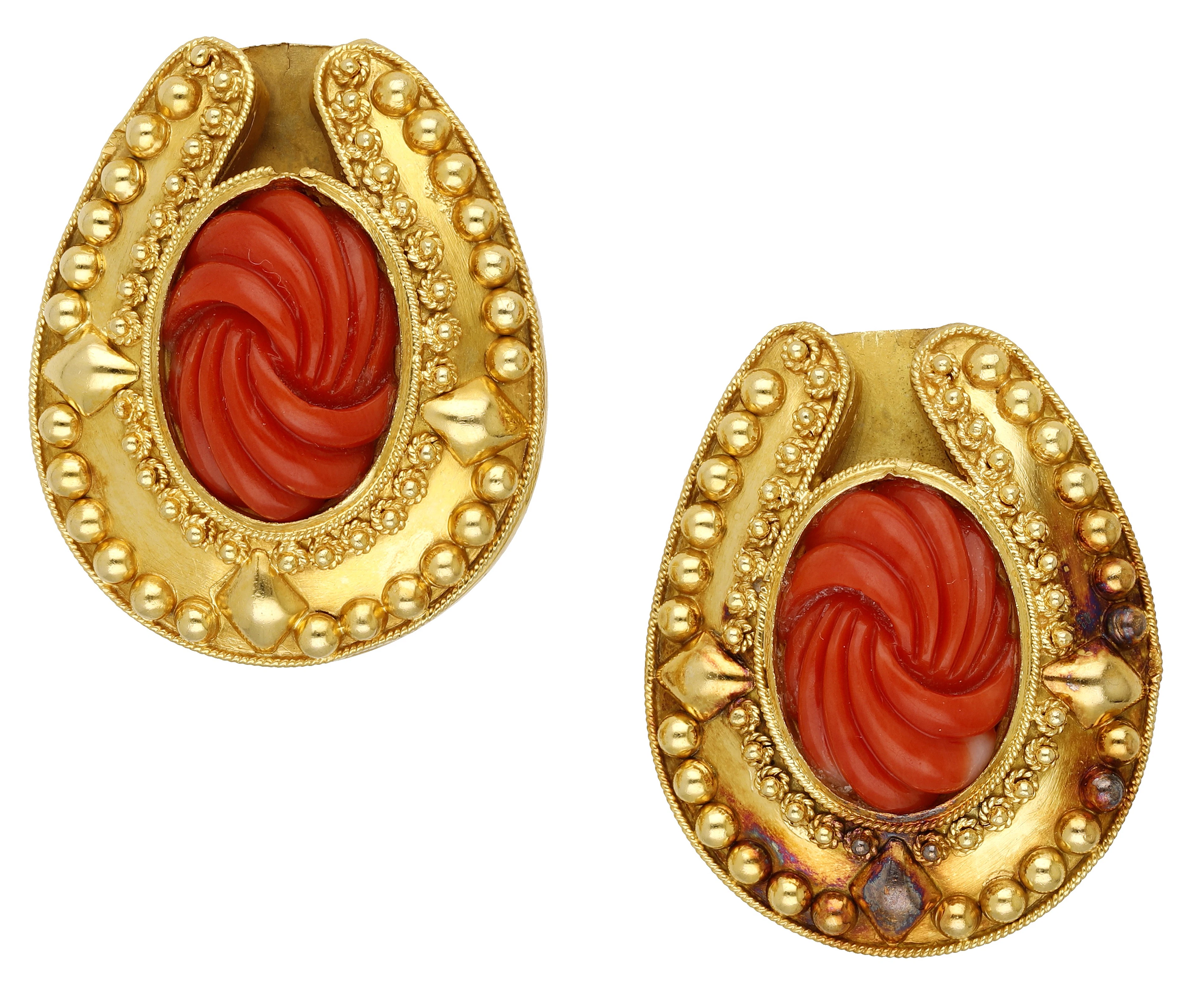 A pair of coral ear clips, the reeded coral ‘Corallium rubrum’ cabochons