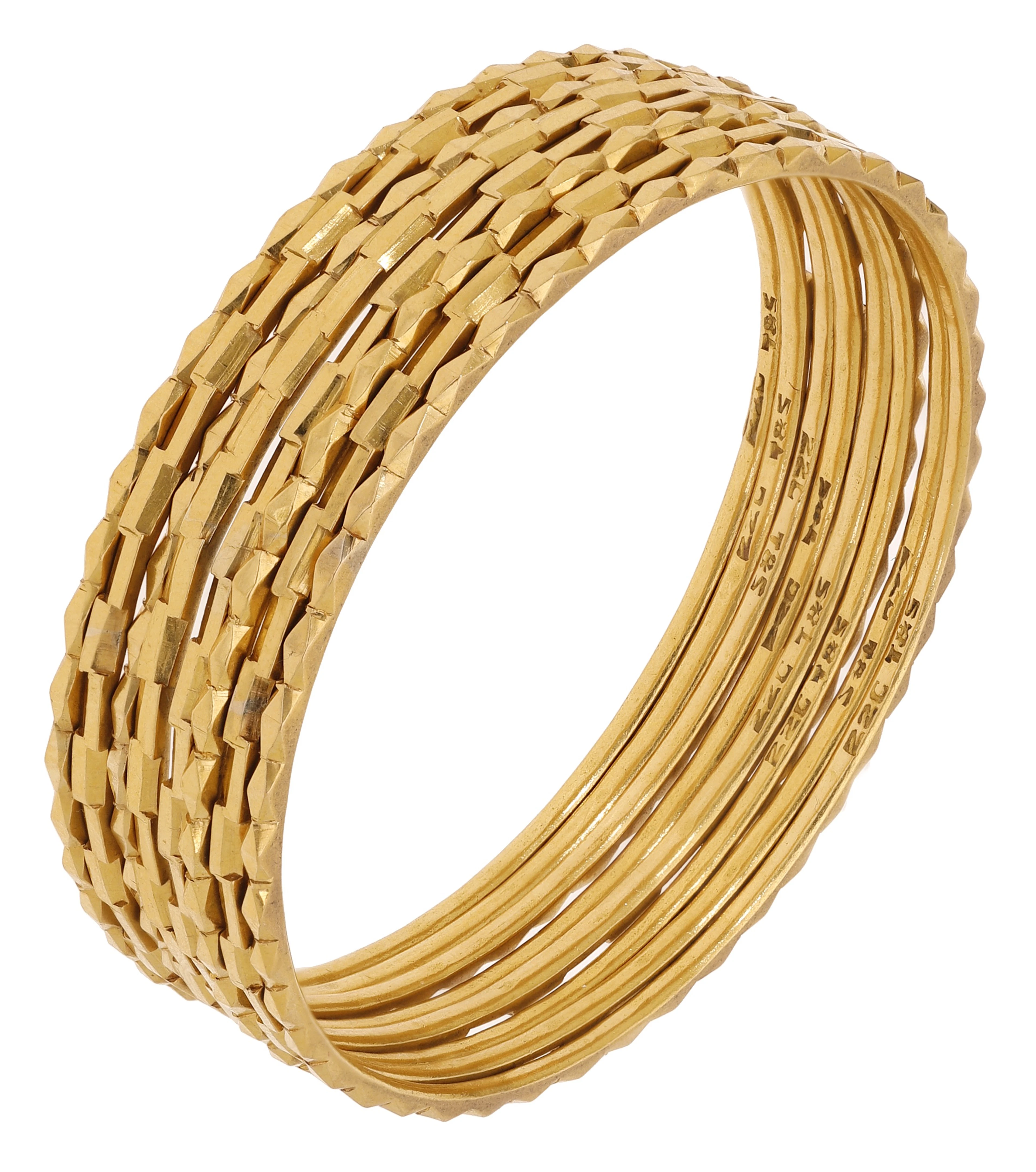 Two sets of four Indian gold bangles, the first set decorated to the