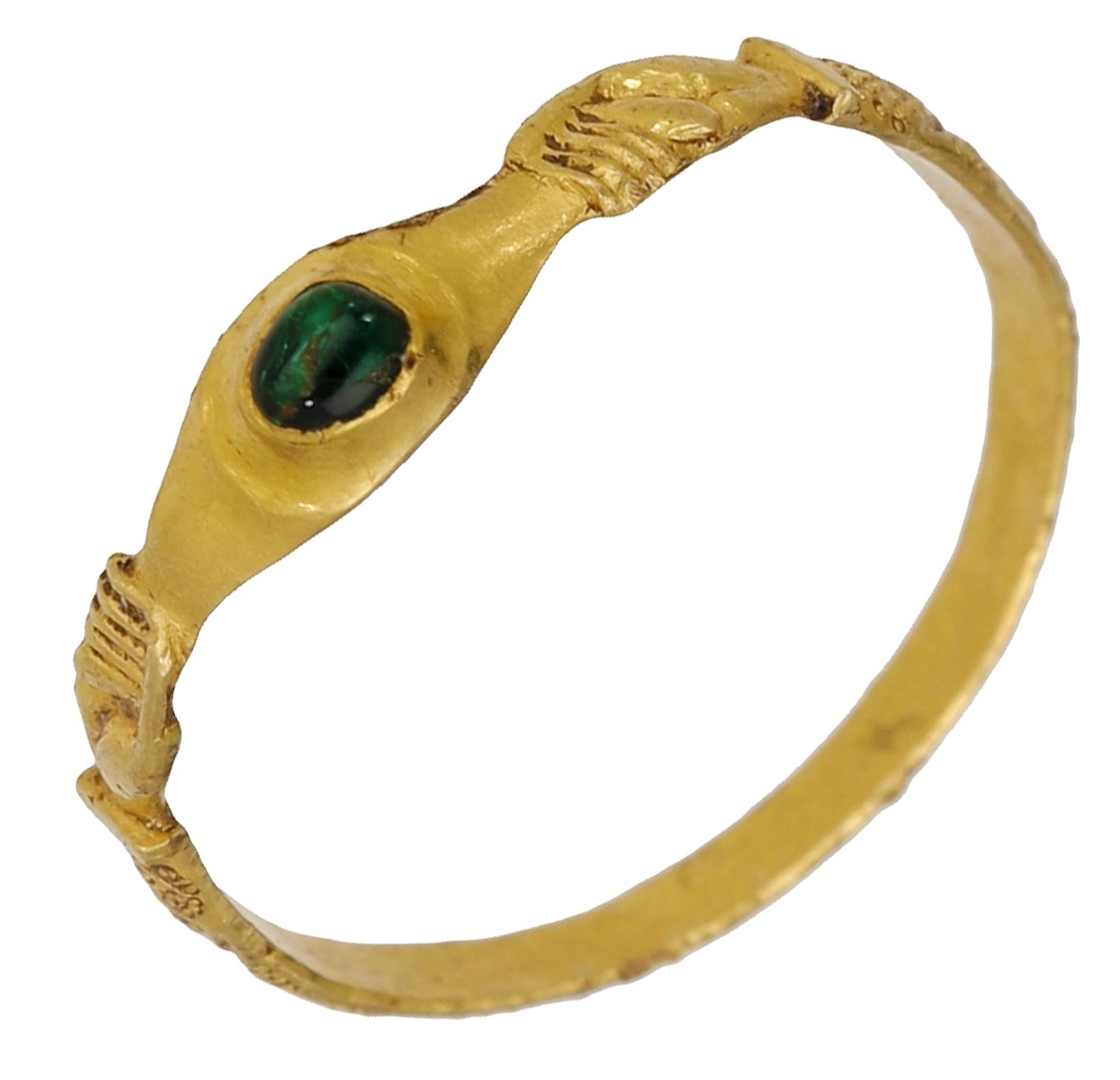 A Medieval emerald stirrup ring, circa 13th - 14th century, the raised