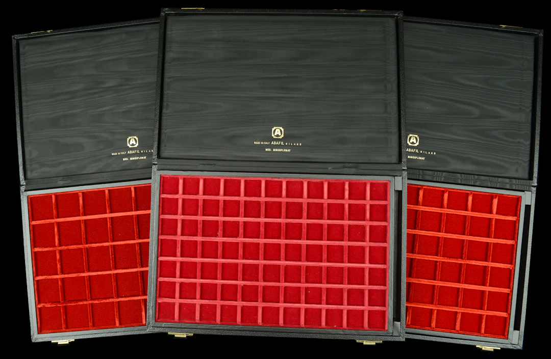 A trio of Abafil Minidiplomat cases (3), each with two loose trays