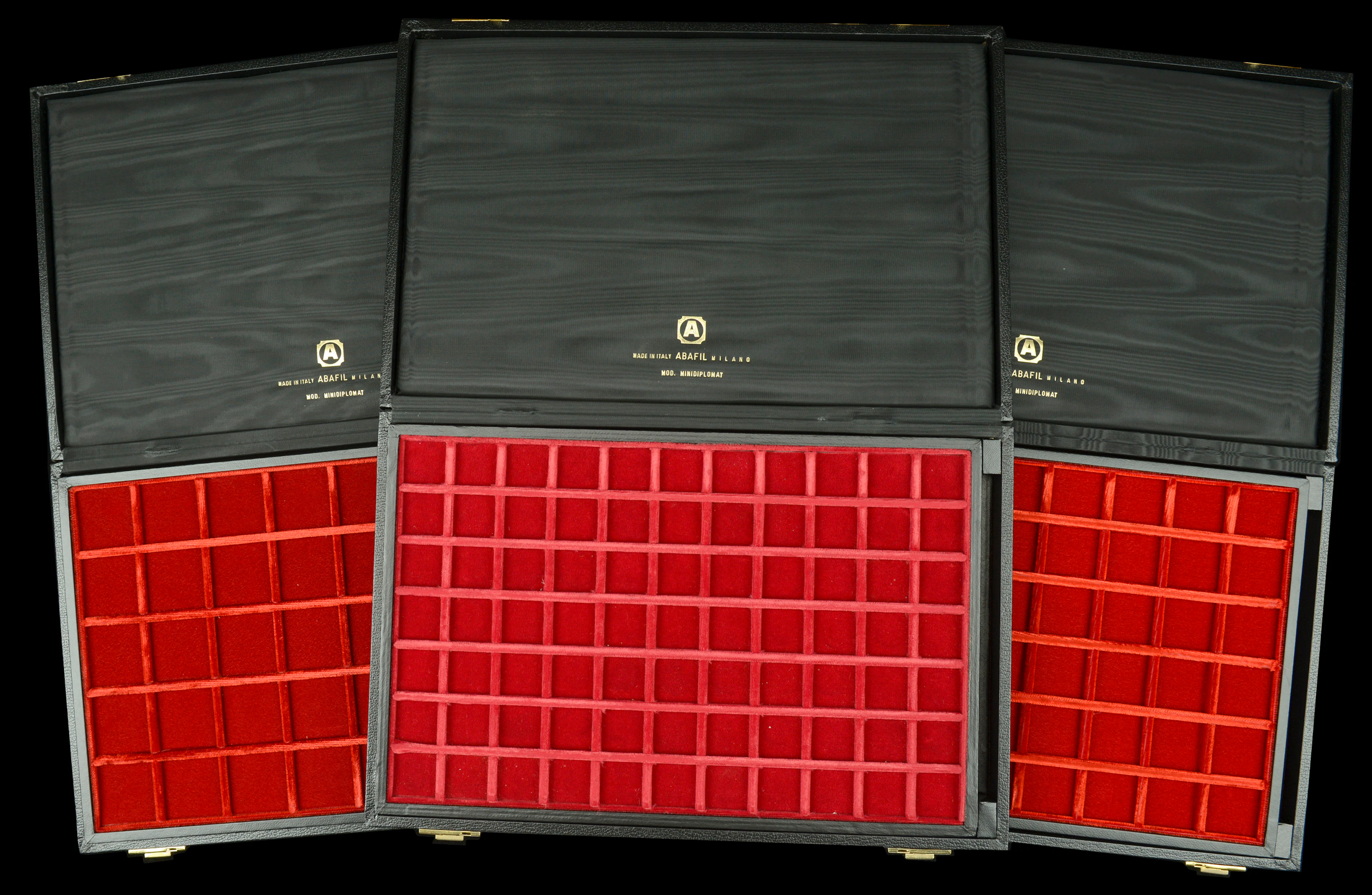 A trio of Abafil Minidiplomat cases (3), each with two loose trays