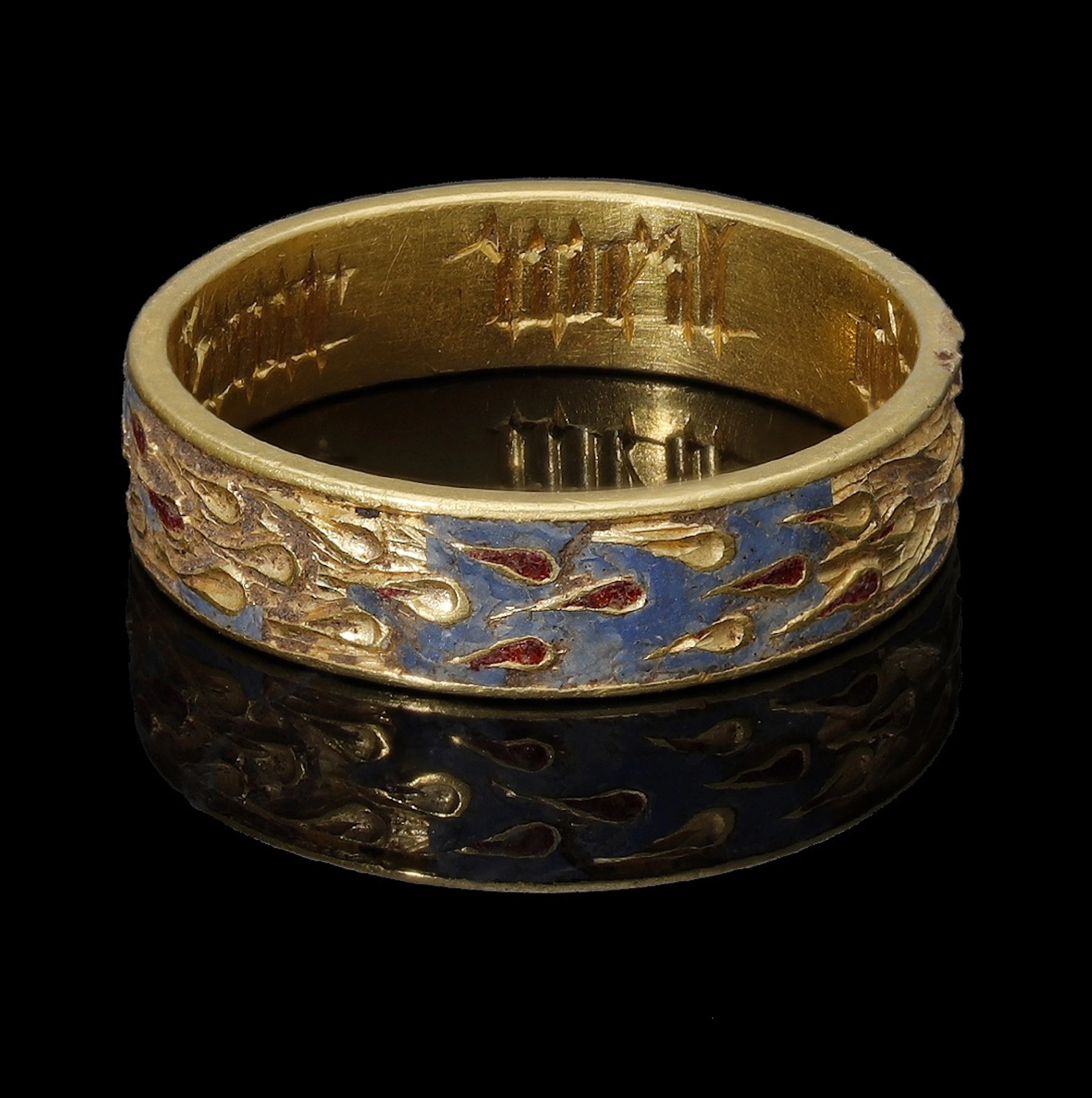 A 15th century enamelled band ring, circa AD. 1400-1500, the flat
