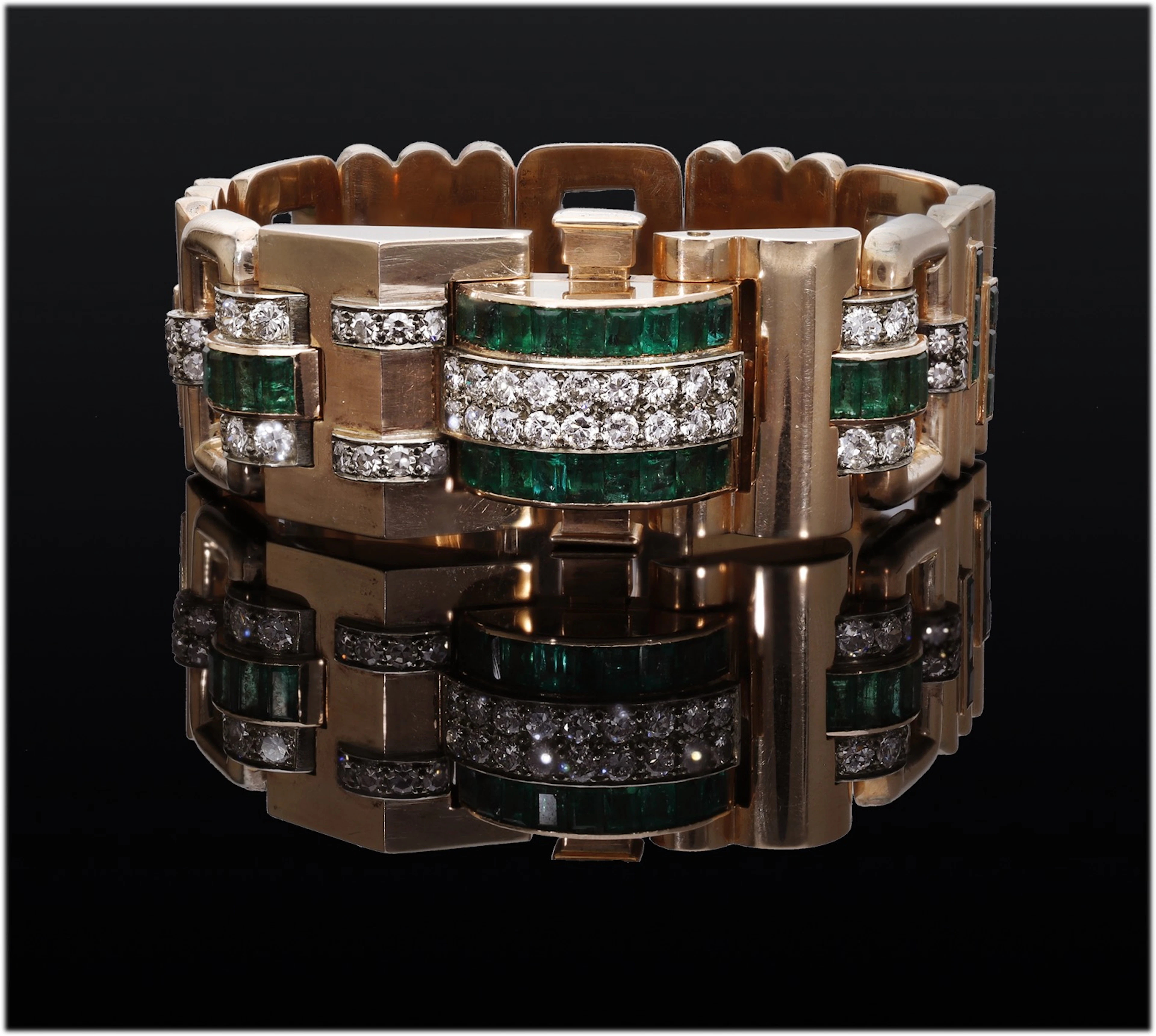 A mid 20th century emerald and diamond bracelet, of bold geometric