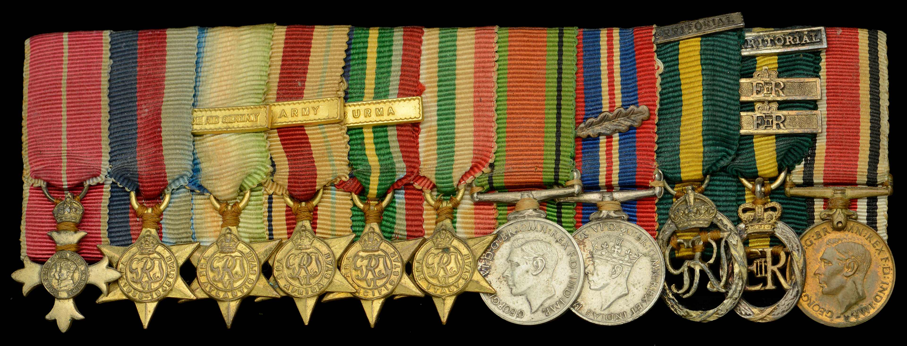 A Second War O.B.E. mounted group of eleven miniature dress medals