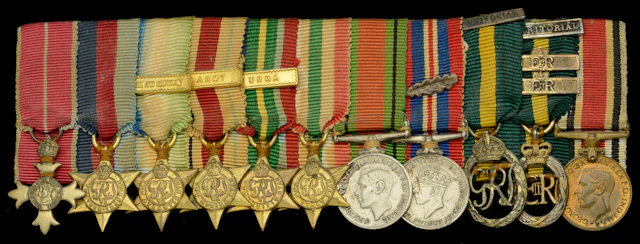 A Second War O.B.E. mounted group of eleven miniature dress medals