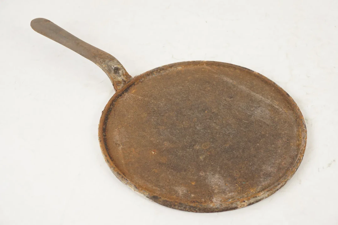 Pannkakslagg i gjutjärn. C51/