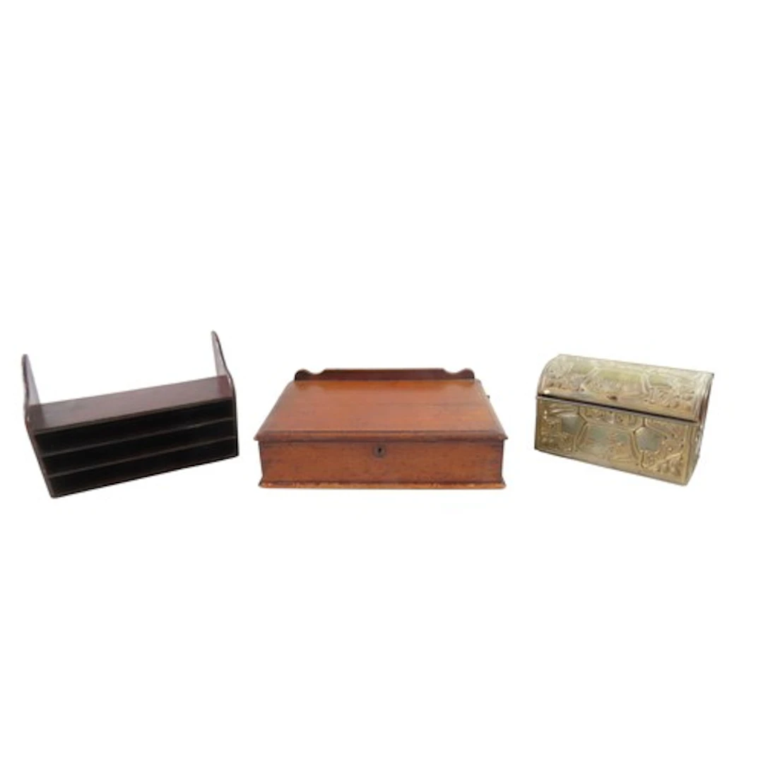 A VICTORIAN MAHOGANY WRITING BOX the hinged top tilting on a...