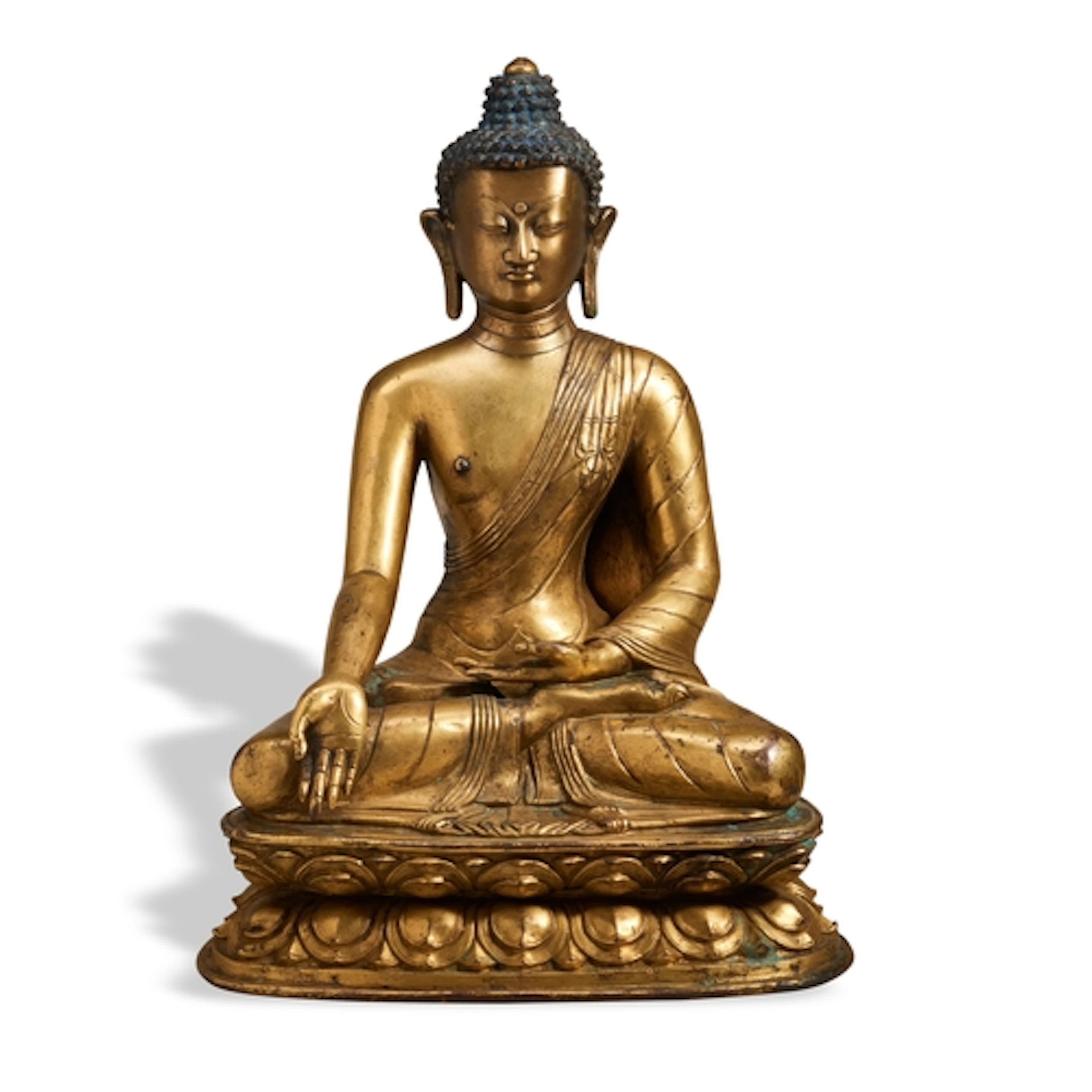 A SEATED GILT-BRONZE FIGURE OF SHAKYAMUNI BUDDHA SINO-TIBETA...