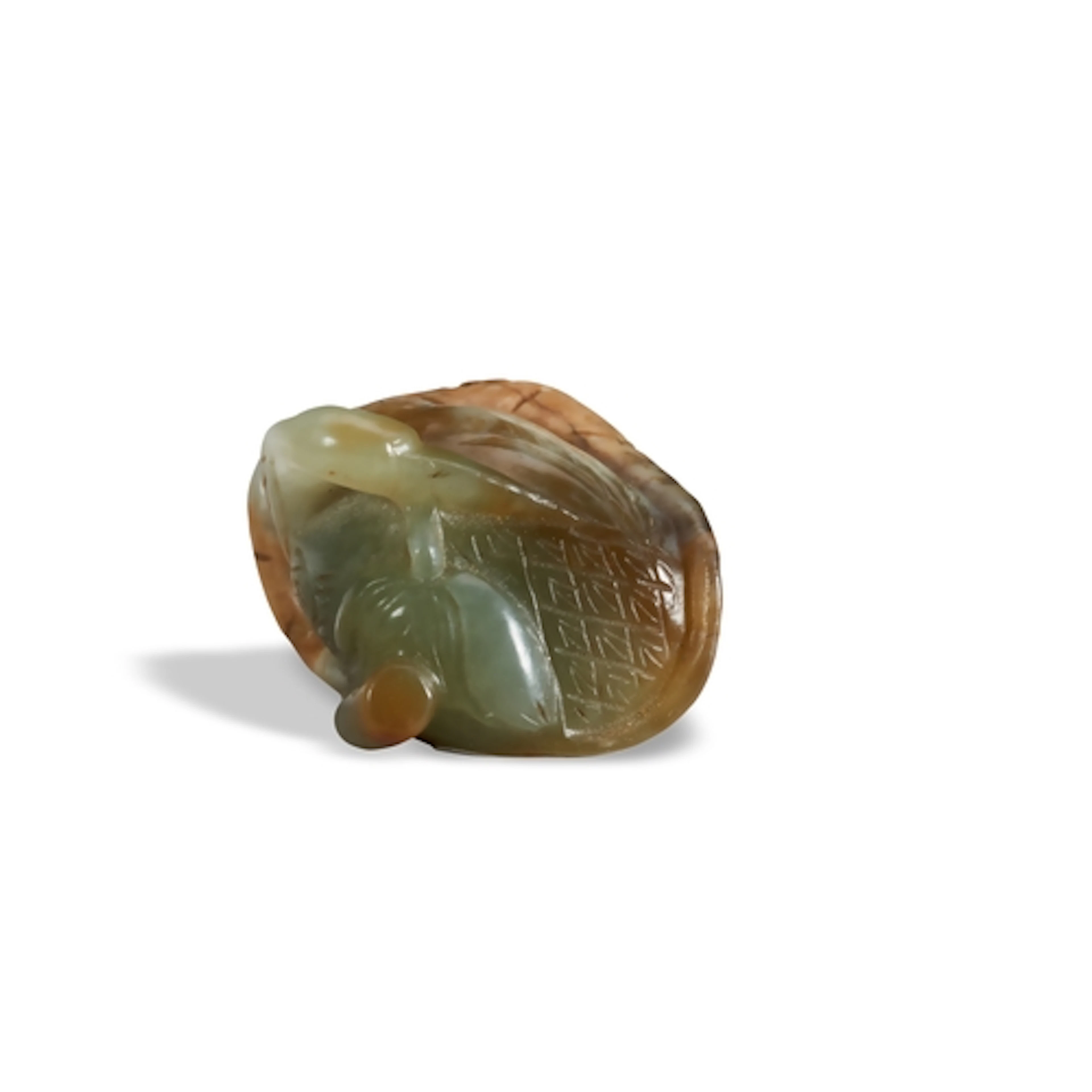 A CELADON AND RUSSET JADE 'GOOSE AND LEAF' GROUP QING DYNAST...