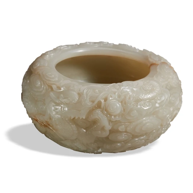 A WHITE JADE 'DRAGON' ALMS BOWL QING DYNASTY (1644-1911) 青白雕...