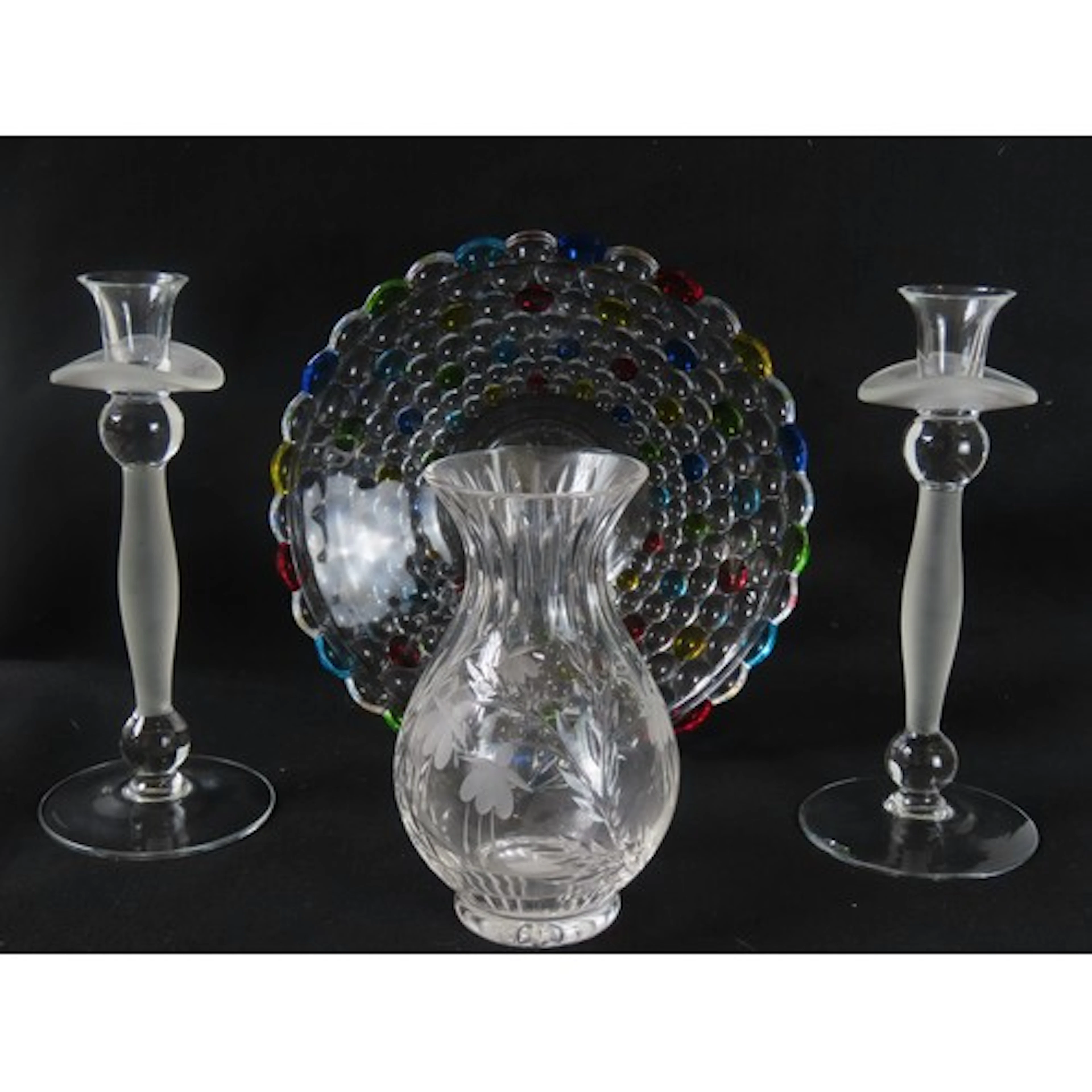 A PAIR OF HANDMADE GLASS CANDLESTICKS with trumpet form nozz...