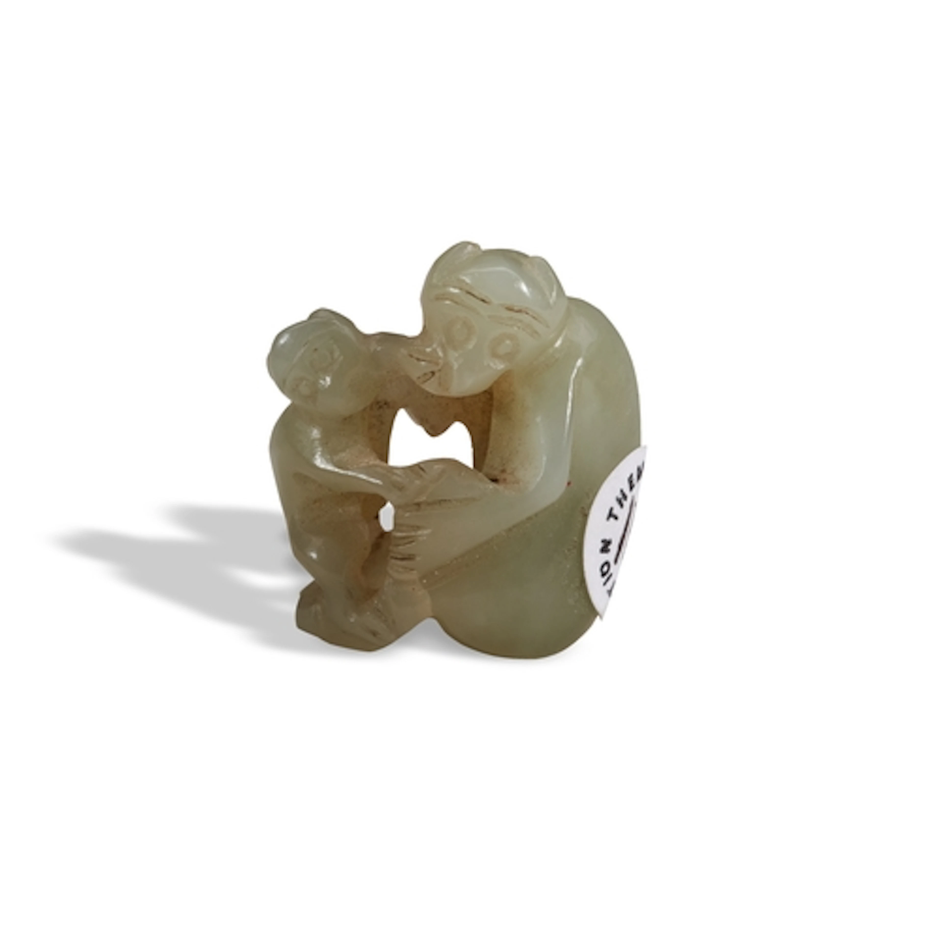 A CELADON JADE 'MONKEYS' GROUP QING DYNASTY, 19TH CENTURY 褐玉...