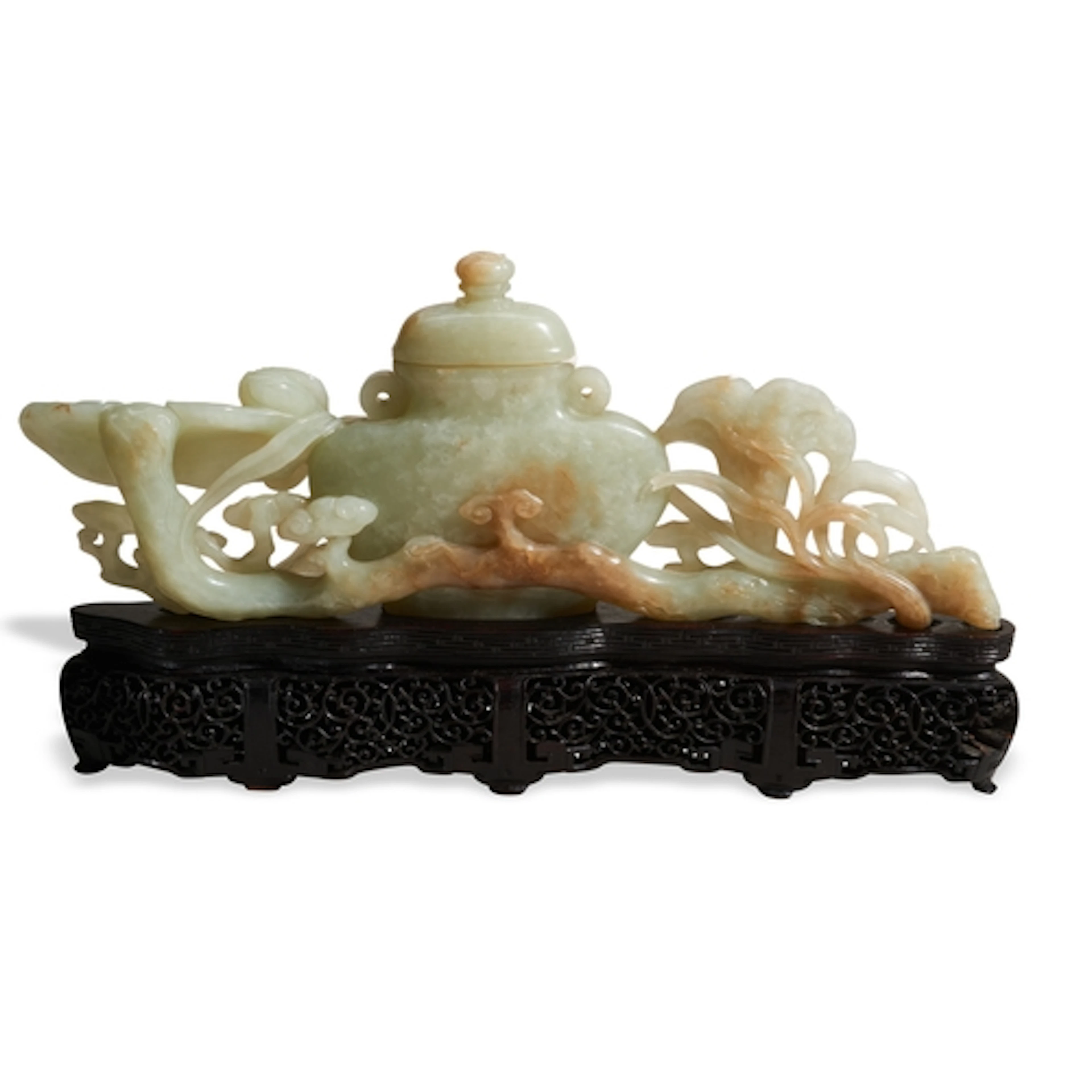 A GOOD PALE-CELADON JADE 'RUYI AND COVERED JAR' GROUP QING D...