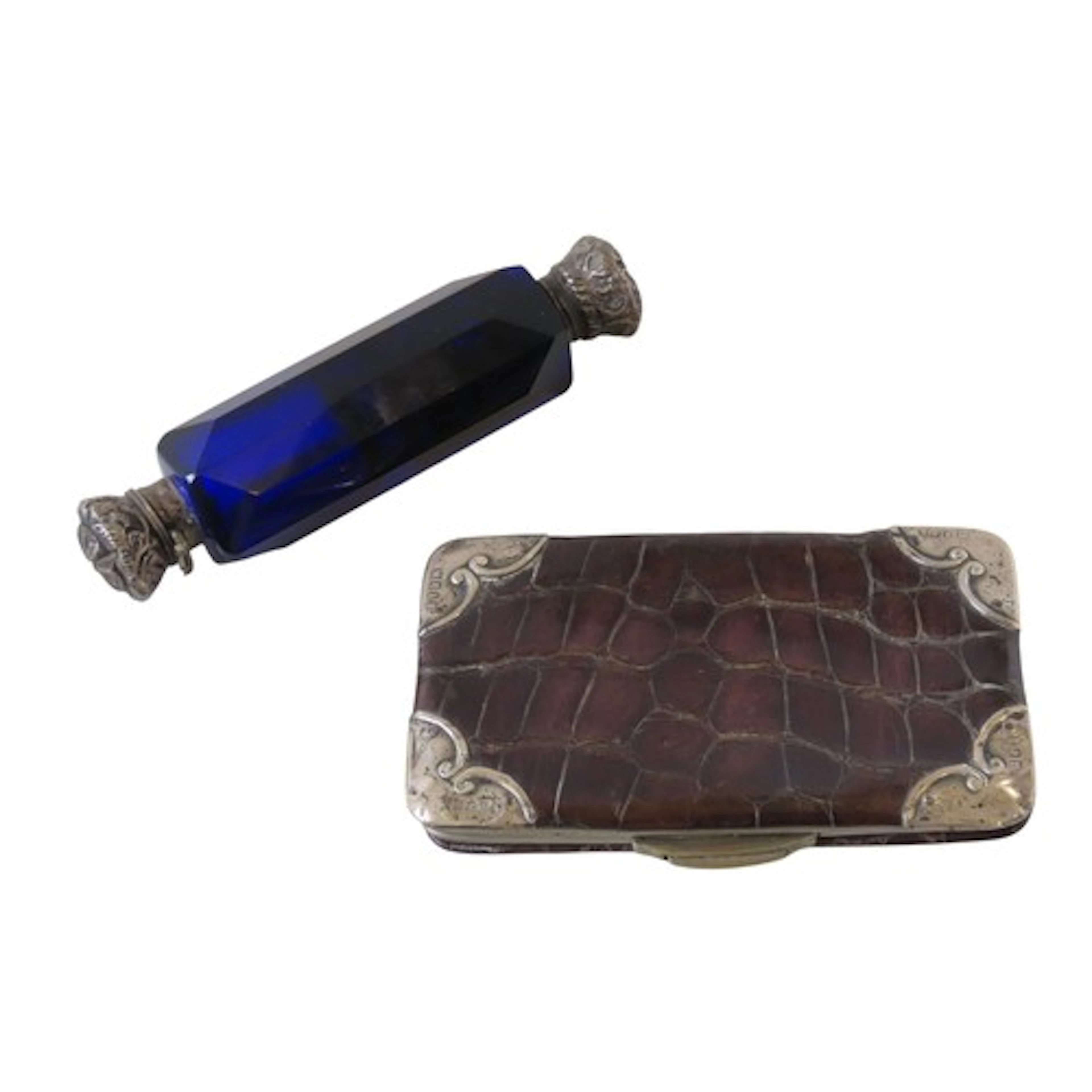 AN EDWARDIAN CROCODILE SKIN PURSE with silver corner mounts,...