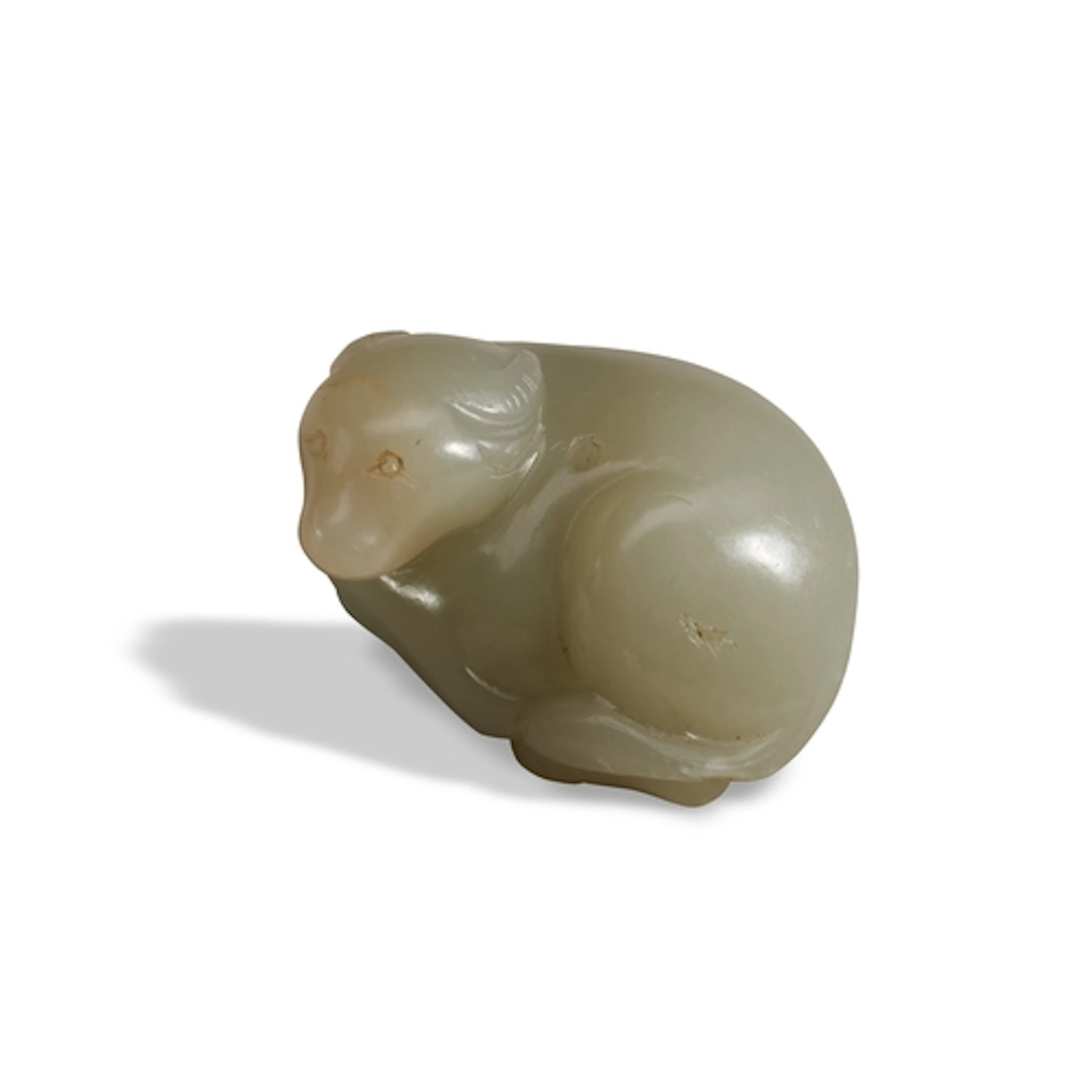 A FINE WHITE JADE CARVING OF A BUFFALO 17TH / 18TH CENTURY 青...