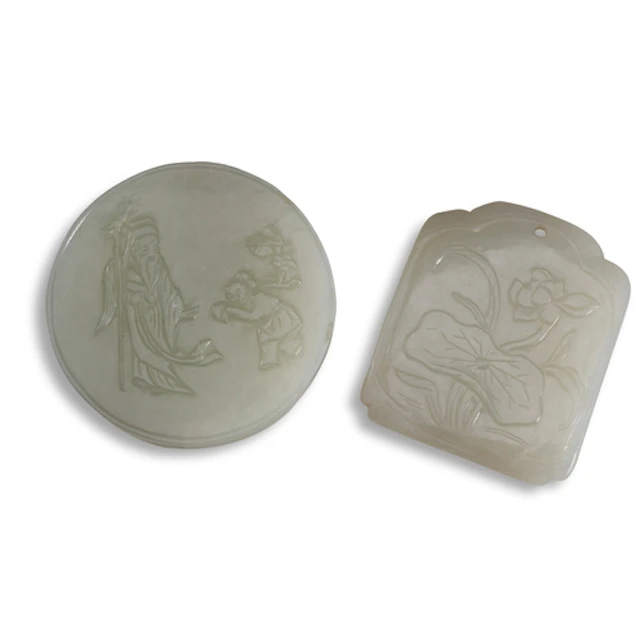 TWO CARVED WHITE JADE PENDANTS 19TH / 20TH CENTURY 青白玉人物及花卉牌...