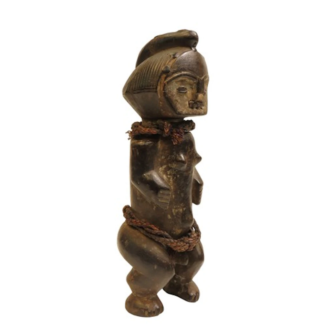 AN AMBETE RELIC STATUE from Burkina Faso, the patinated body...