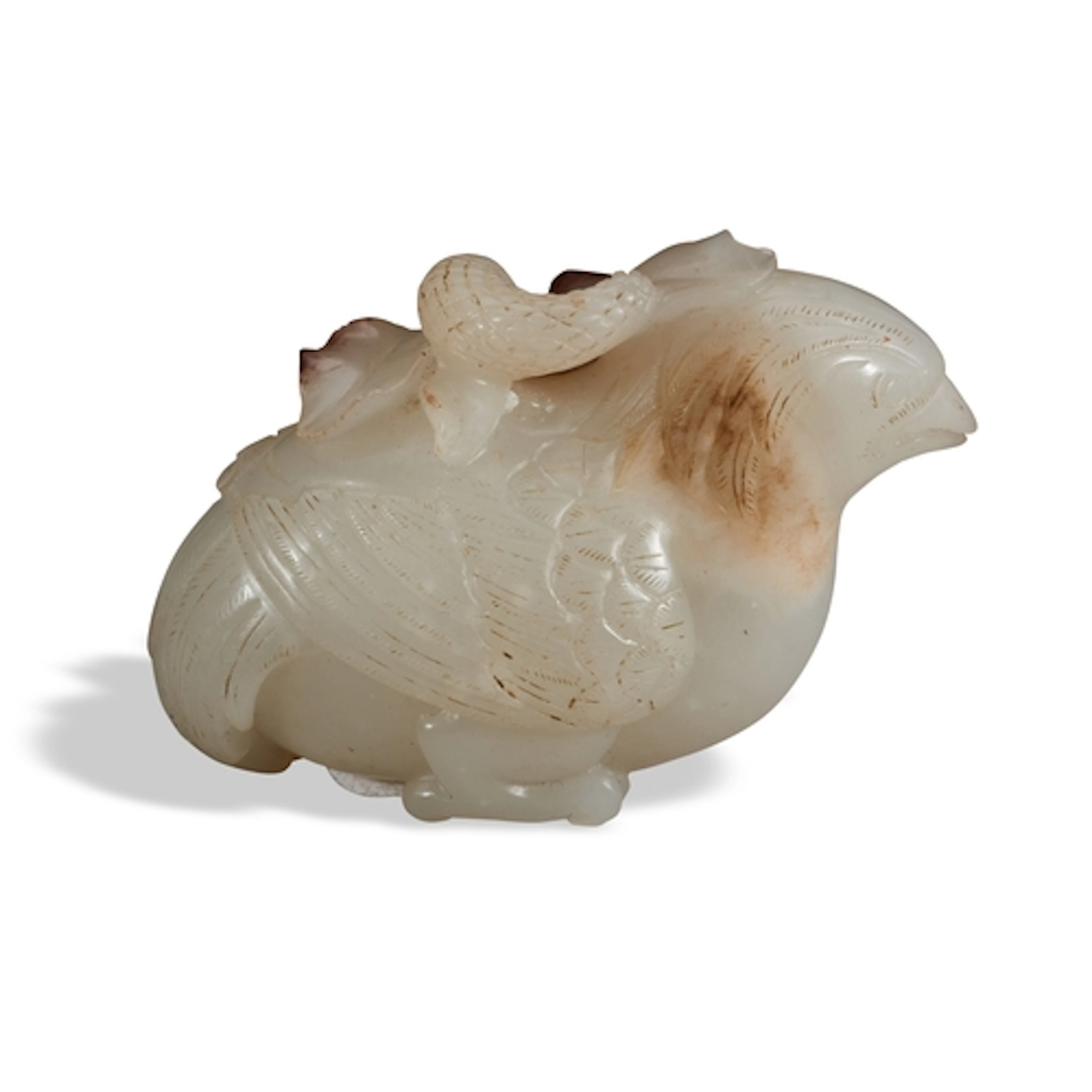 A WHITE AND BROWN RUSSET JADE FIGURE OF A QUAIL QING DYNASTY...