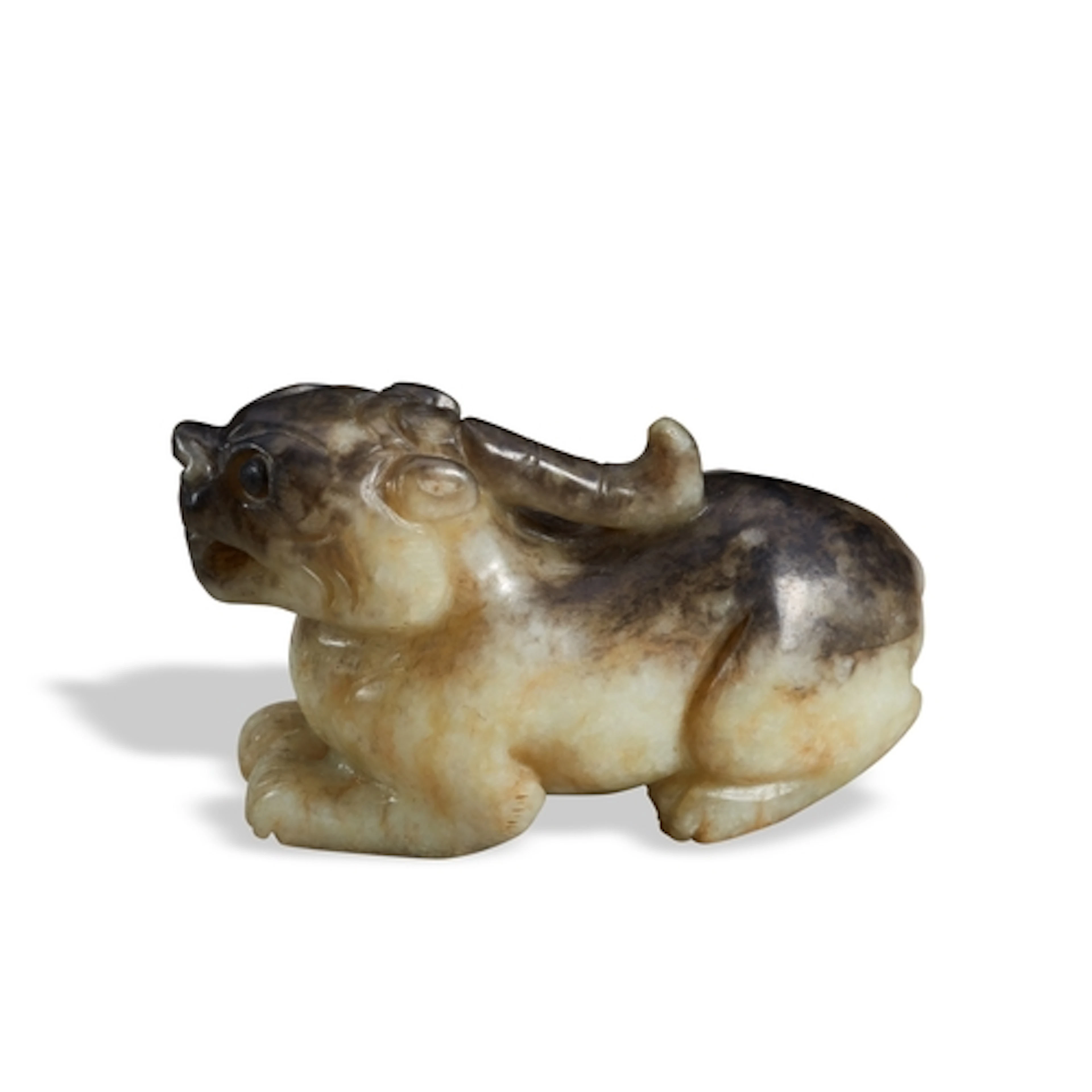 A GREEN AND BLACK JADE MYTHICAL BEAST QING DYNASTY, 19TH CEN...
