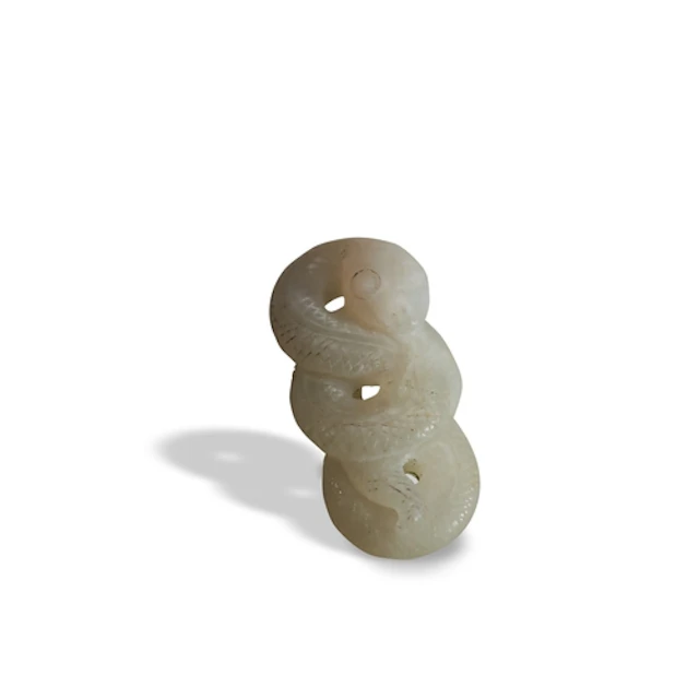 A SMALL WHITE JADE CARVING OF A SNAKE QING DYNASTY, 19TH CEN...