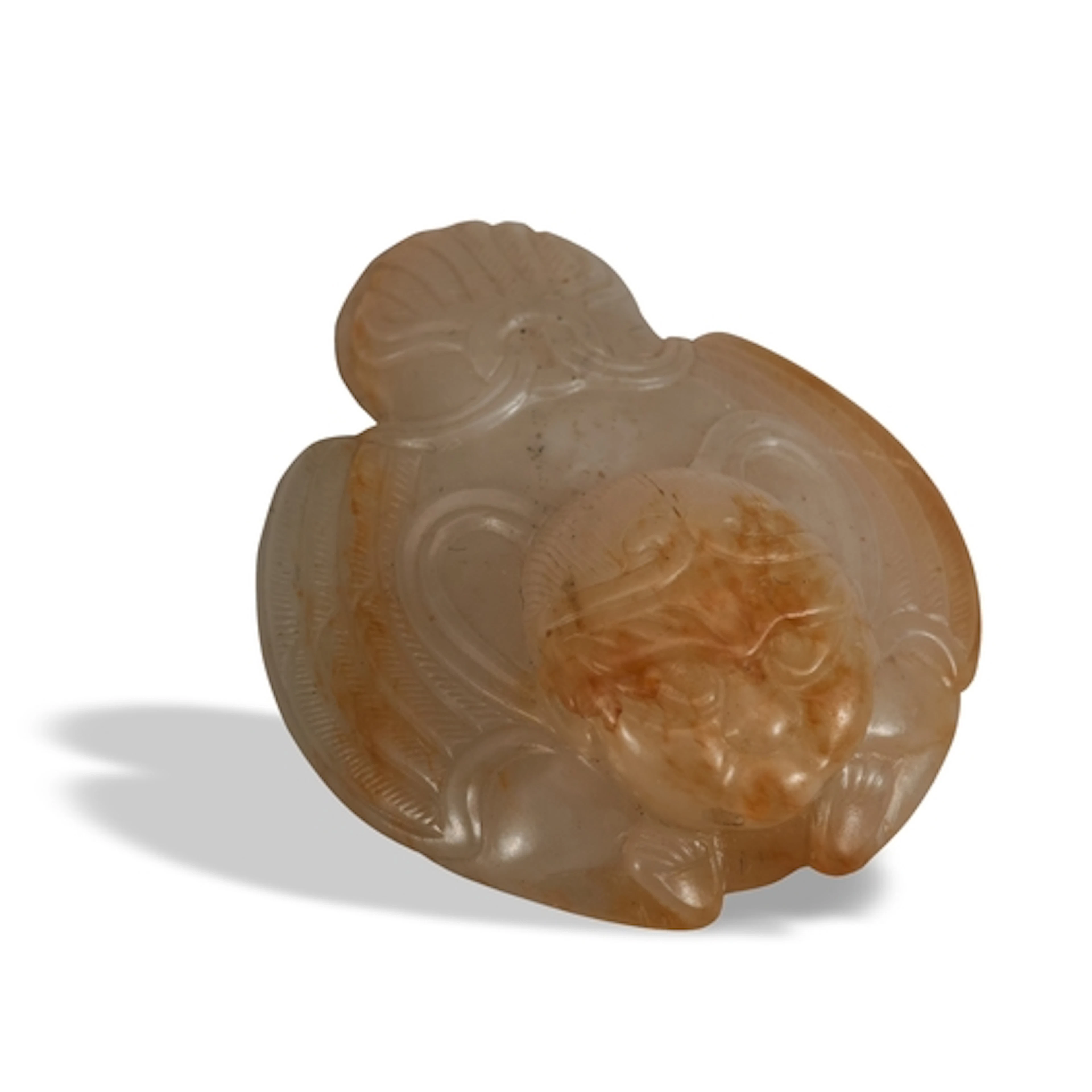 A WHITE AND RUSSET JADE GARUDA WITH DIADEM HAT ORNAMENT MING...