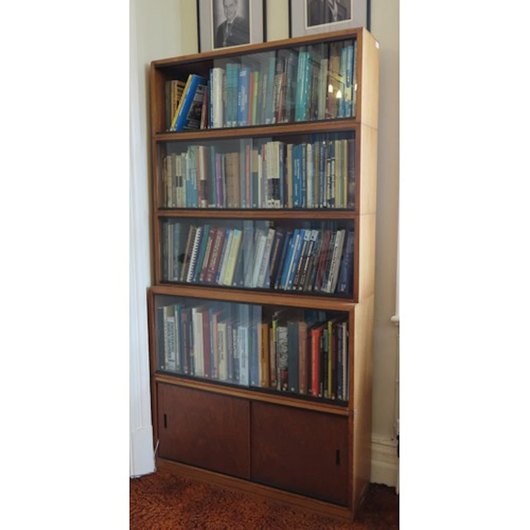 A SIMPLEX SECTIONAL LIBRARY BOOKCASE CIRCA 1965 comprised of...