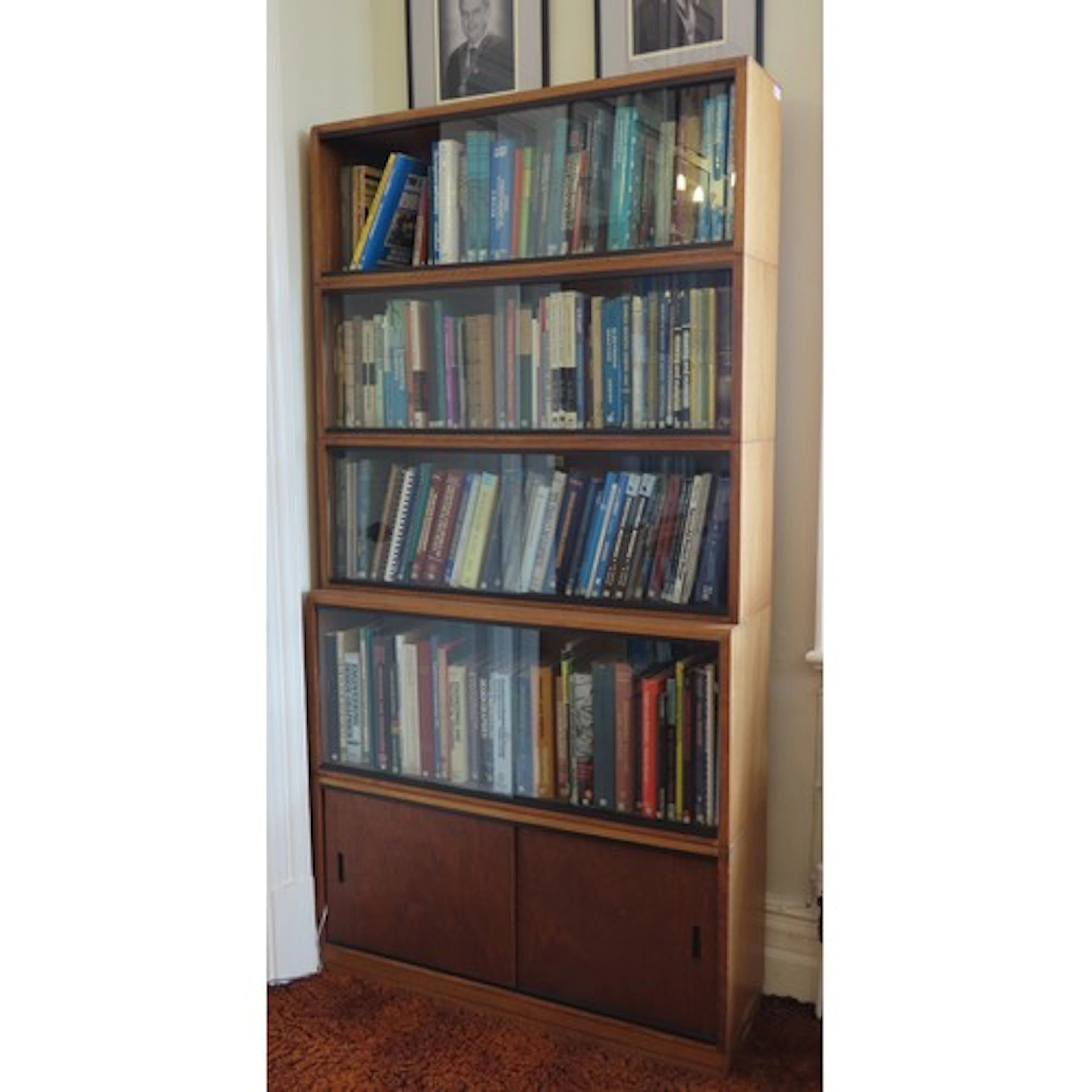 A SIMPLEX SECTIONAL LIBRARY BOOKCASE CIRCA 1965 comprised of...