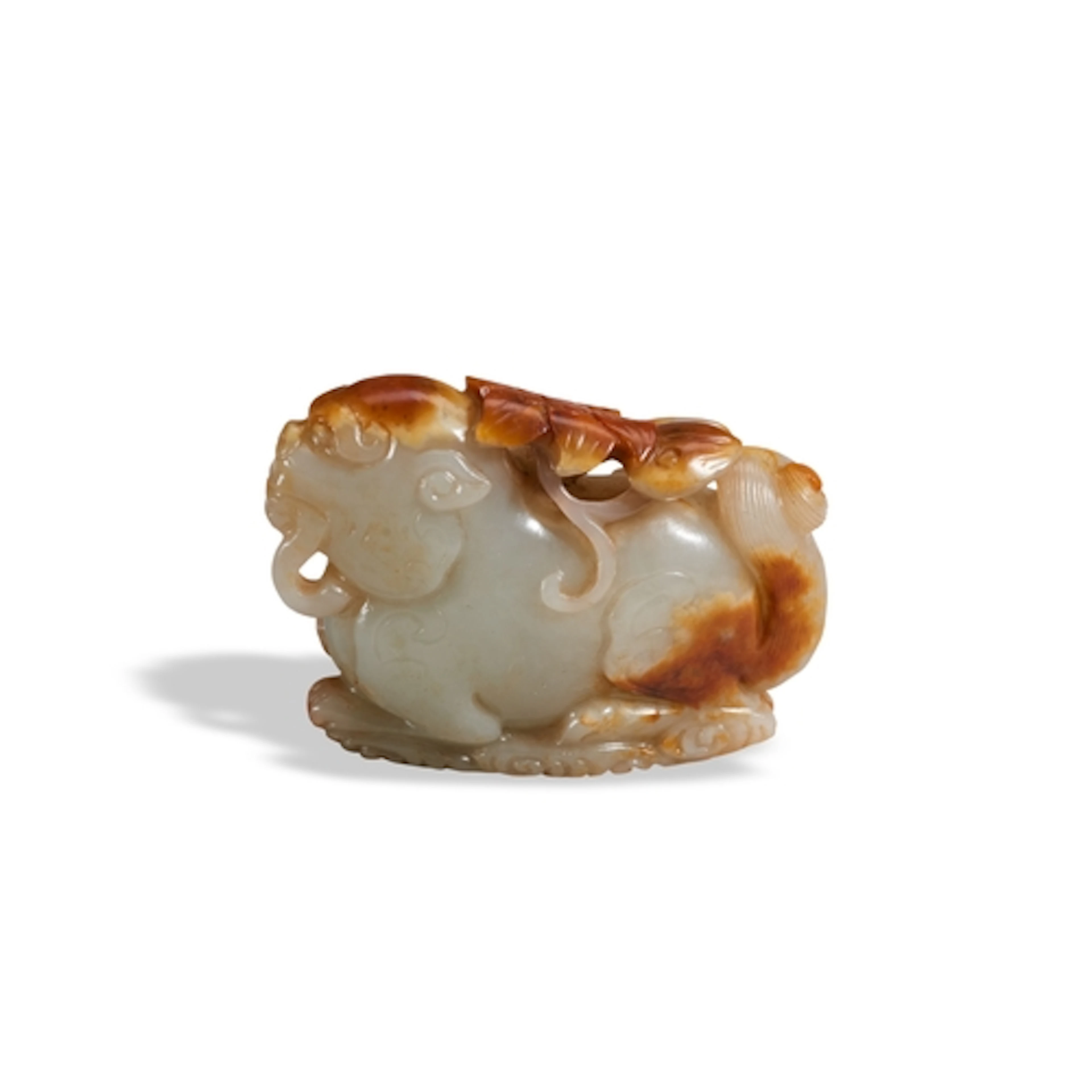 A CELADON AND RUSSET JADE QILIN 20TH CENTURY 褐玉瑞兽 二十世纪 Carve...