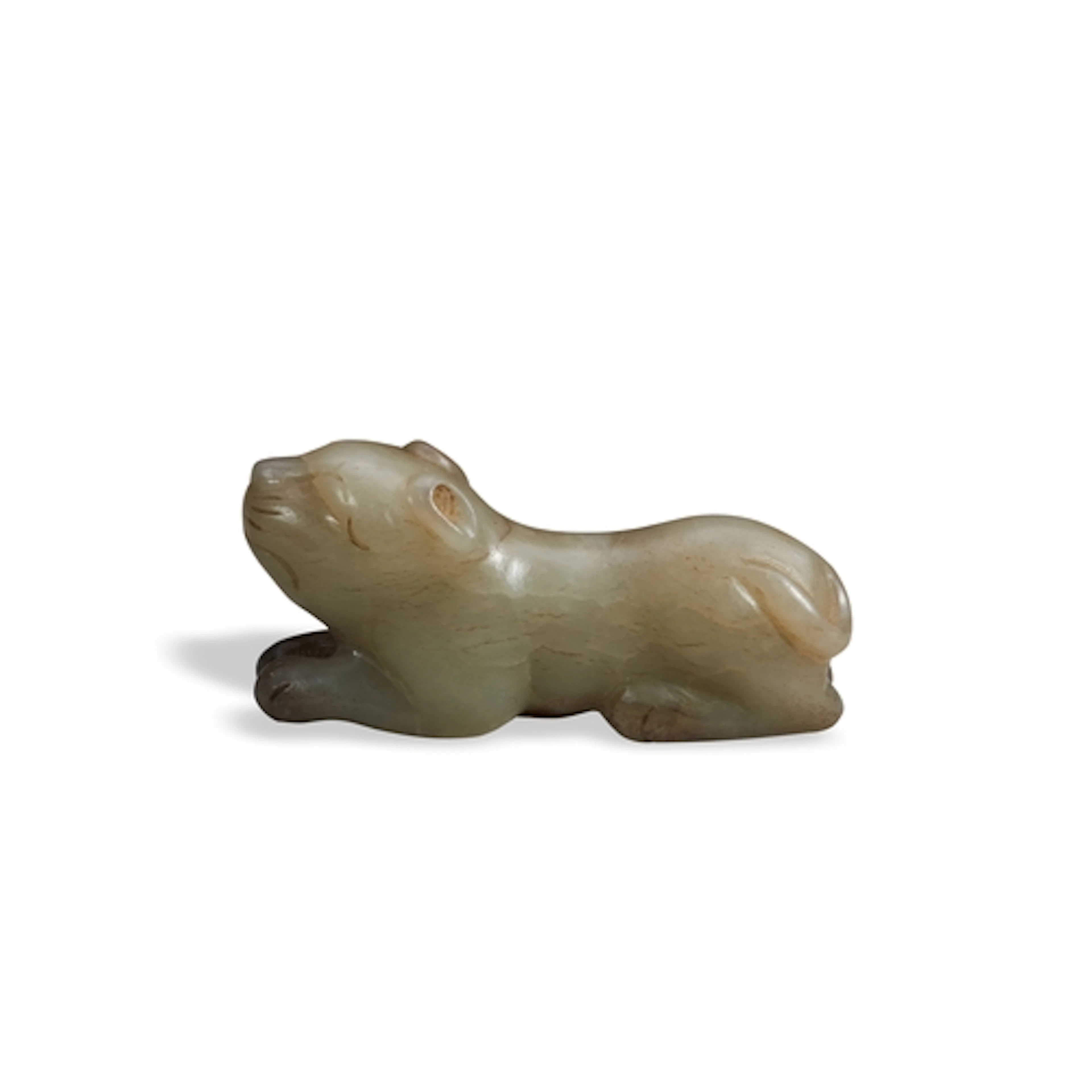 A MOTTLED GREYISH-GREEN JADE FIGURE OF A FELINE QING DYNASTY...