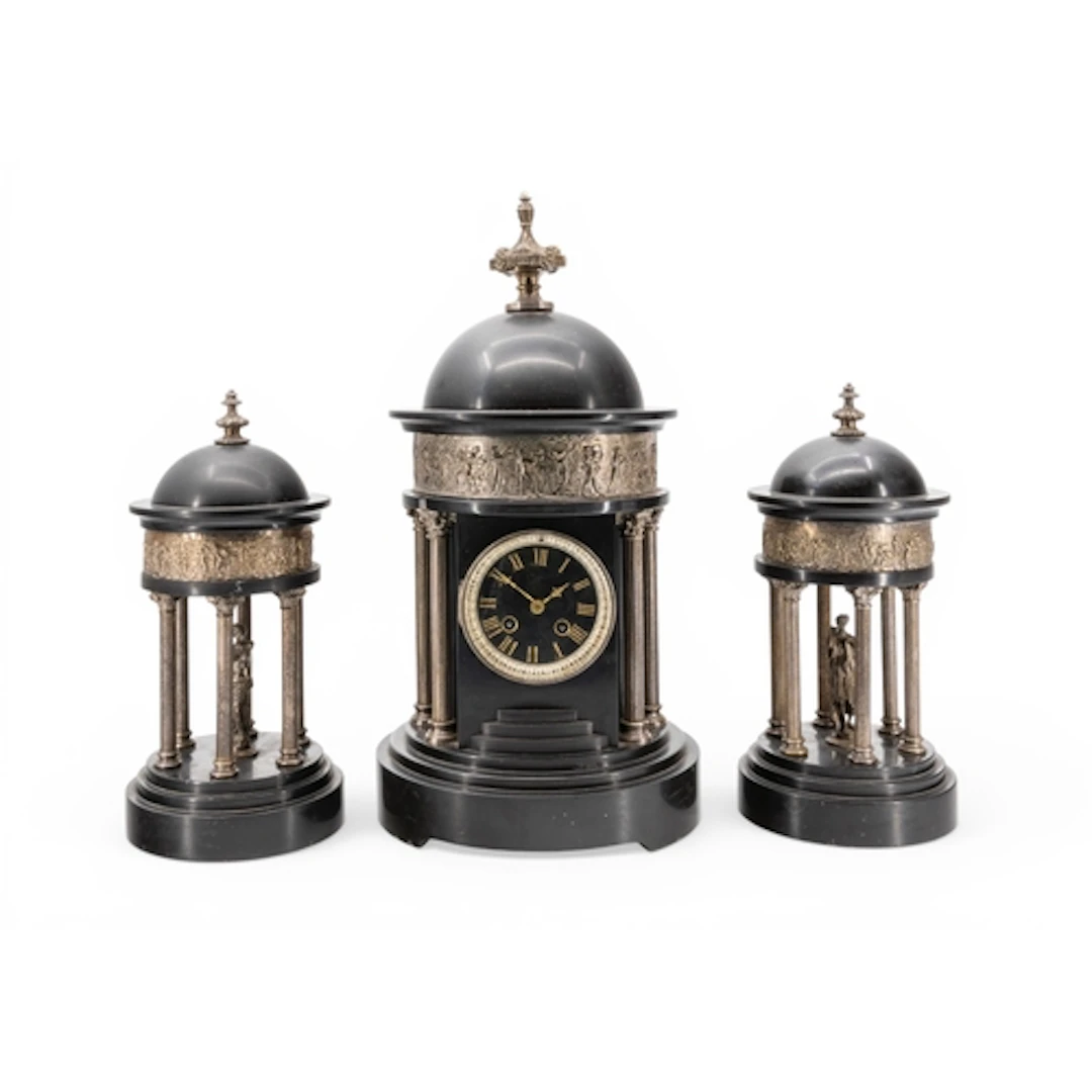 A VICTORIAN BLACK MARBLE CLOCK GARNITURE in the form of a cl...