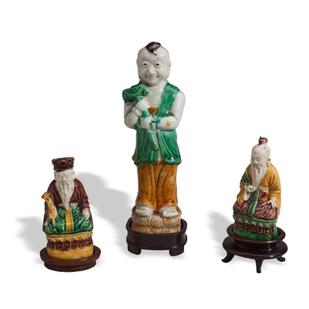 A GROUP OF THREE FAMILLE VERTE BISCUIT SANCAI FIGURES KANGXI...