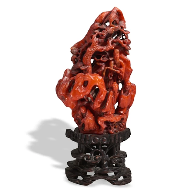 A RARE CARVED AMBER GROUP QING DYNASTY (1644-1911) 琥珀山石人物摆件 ...