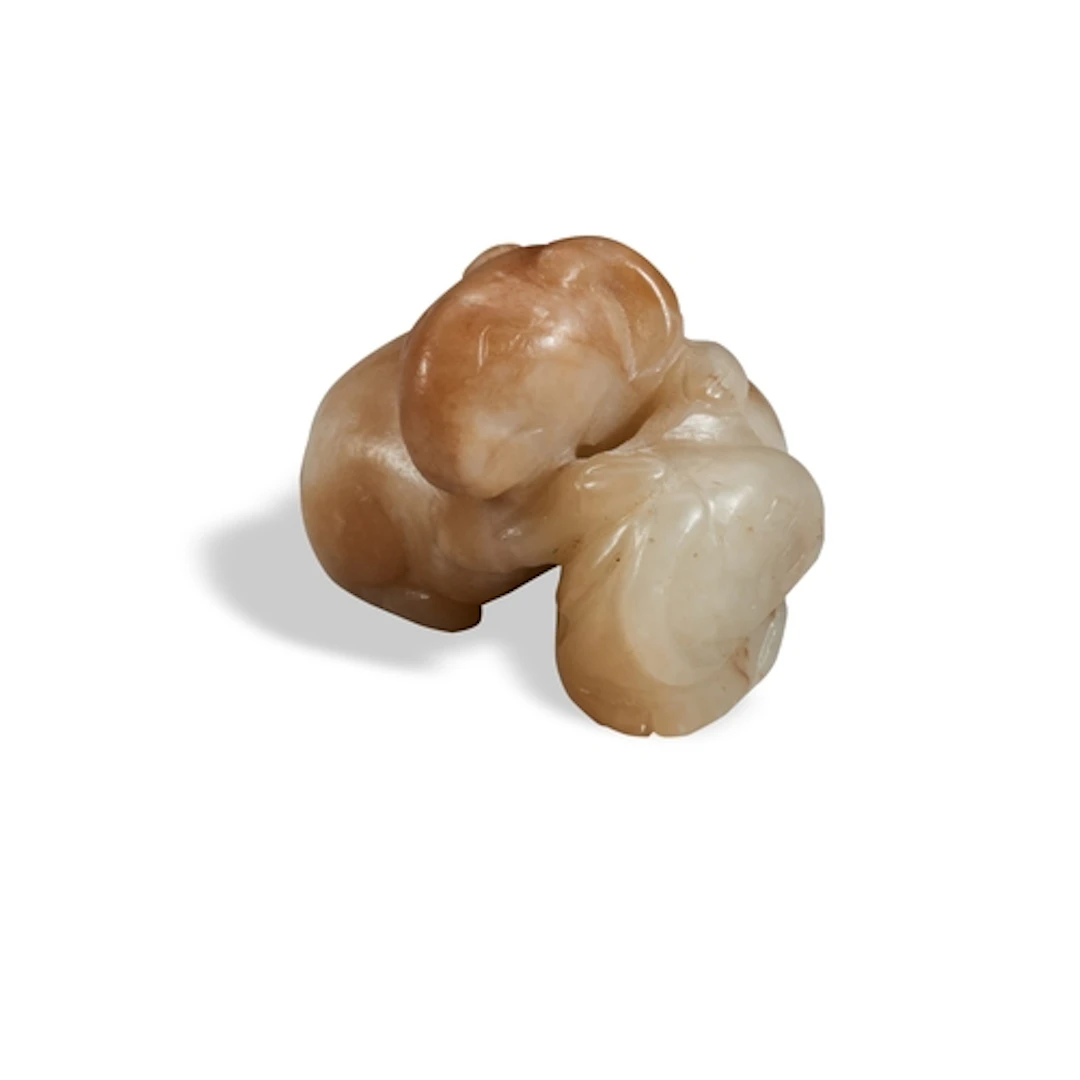A MOTTLED CREAMY-GREY JADE RAMS GROUP, QING DYNASTY, 19TH CE...
